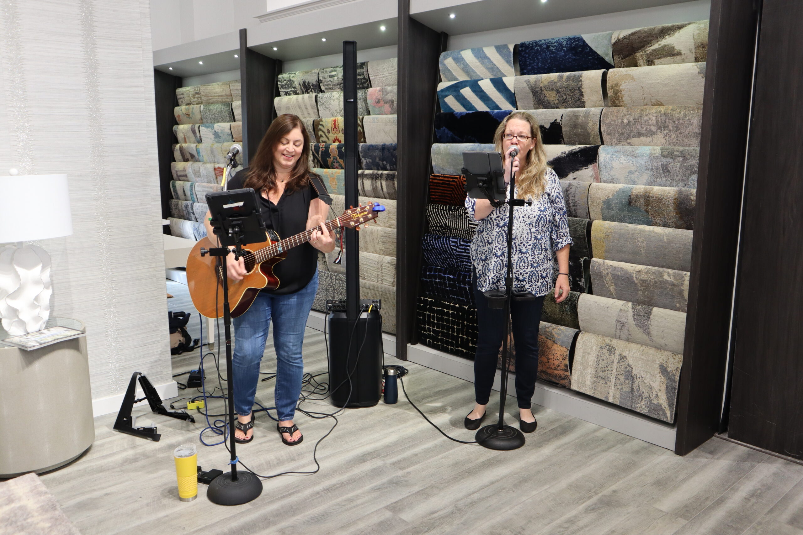 The Barroom Girls, Jessie Haynes and Erin Doherty, perform at the grand opening of The Carpetman by Stark. MEGAN NAFTALI