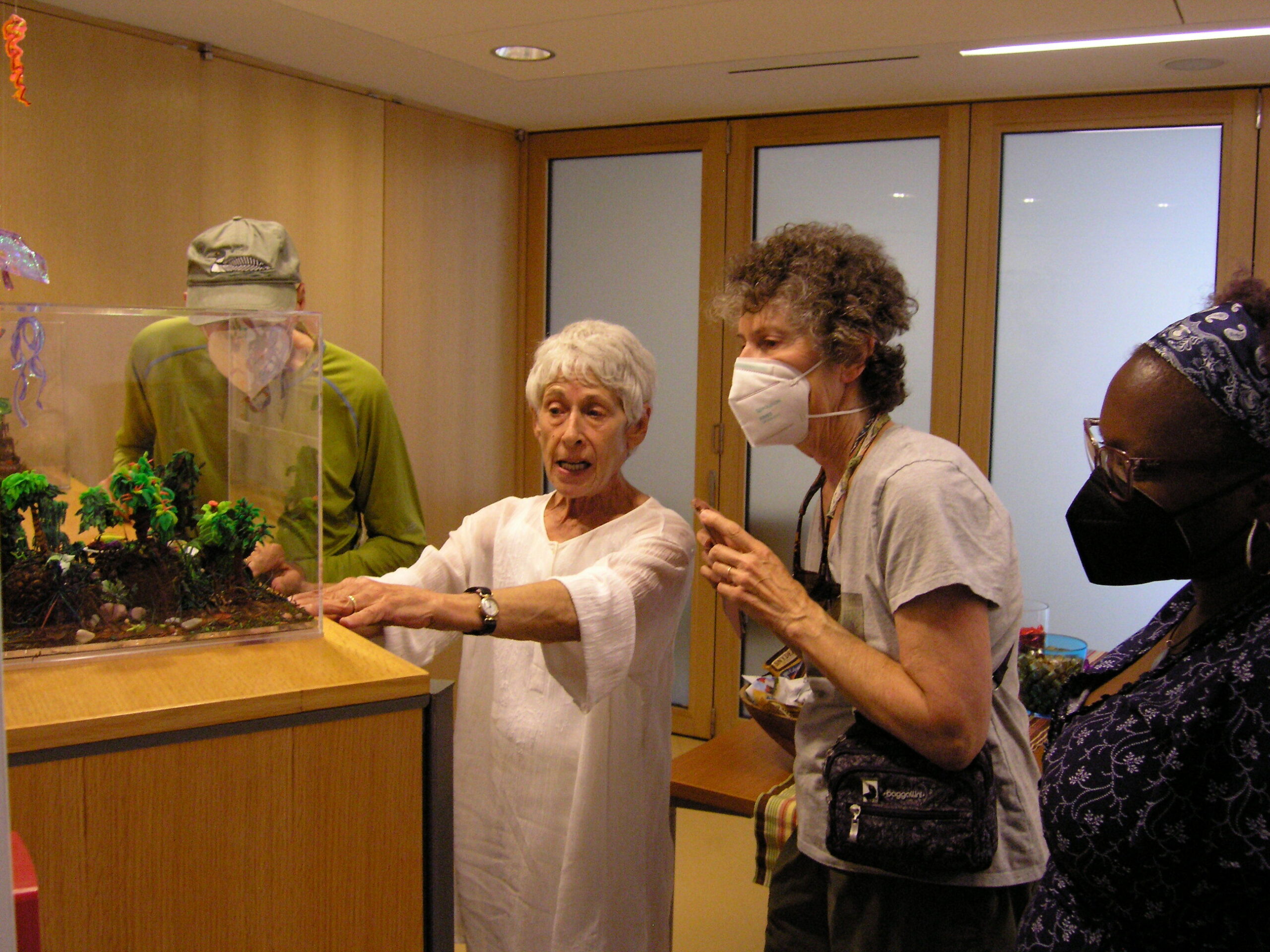 COURTESY ALLAN KRONZEK Ruby Jackson (middle) with art fans at the opening party for her exhibit at John Jermain Library in Sag Harbor on July 11.