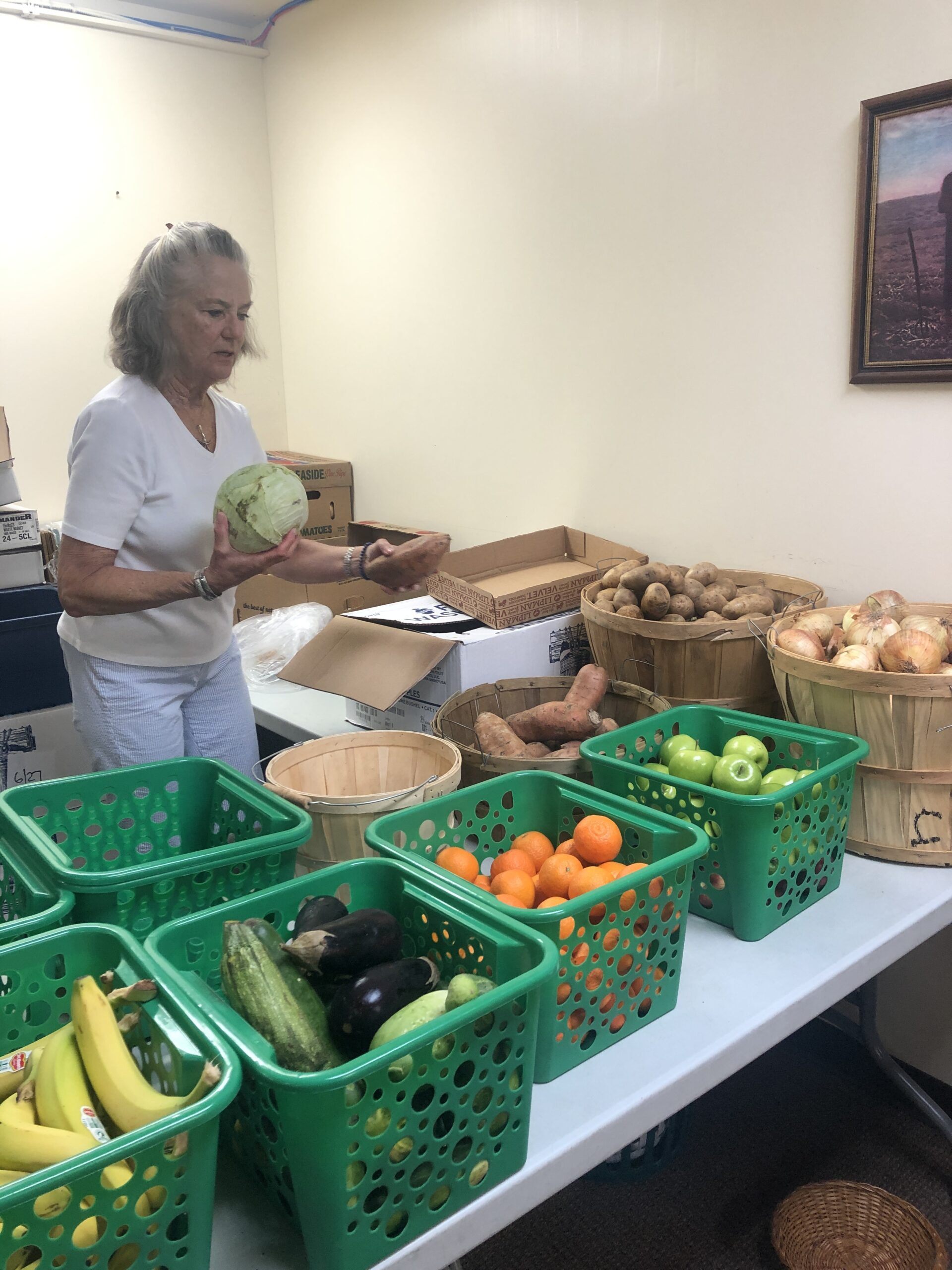 Volunteers were at work filling out grocery lists earlier this week at the food pantry at St. Rosalie's Church in Hampton Bays. CAILIN RILEY PHOTOS