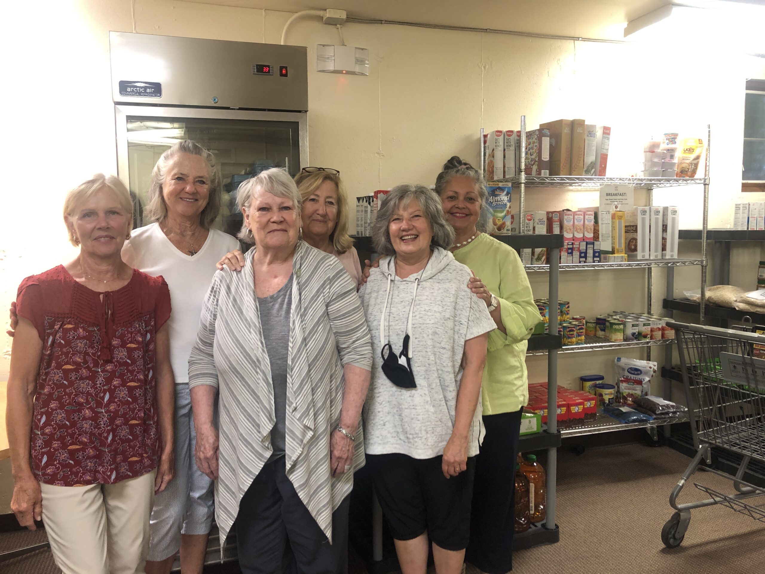 Volunteers were at work filling out grocery lists earlier this week at the food pantry at St. Rosalie's Church in Hampton Bays. CAILIN RILEY PHOTOS