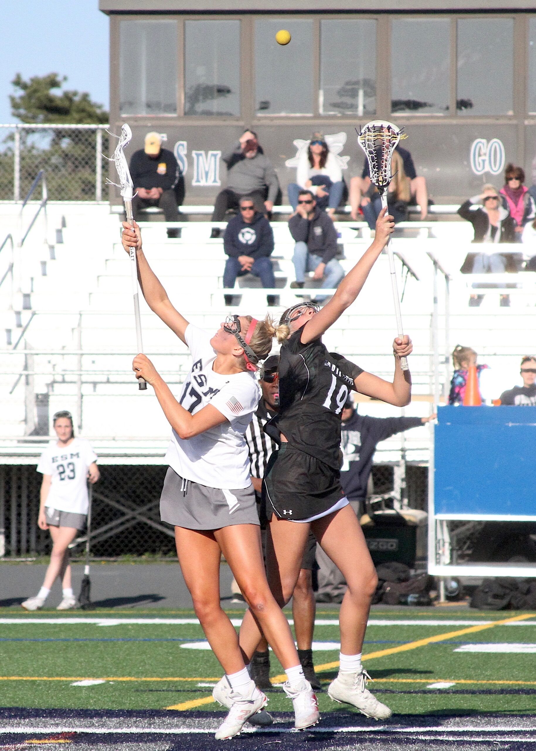 Westhampton Beach's recent senior midfielder Olivia Rongo faces an opponent inside the draw circle. DESIRÉE KEEGAN