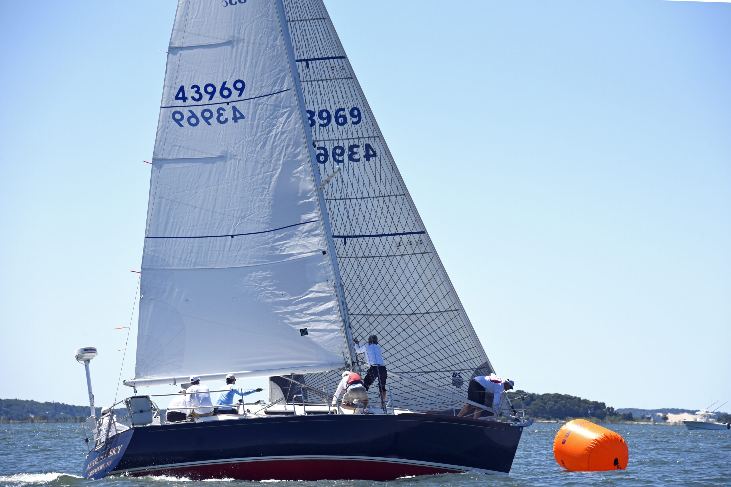Non-spinnaker winner Philip Walters at the wheel of his J35 August Sky rounding the weather mark.    MICHAEL MELLA
