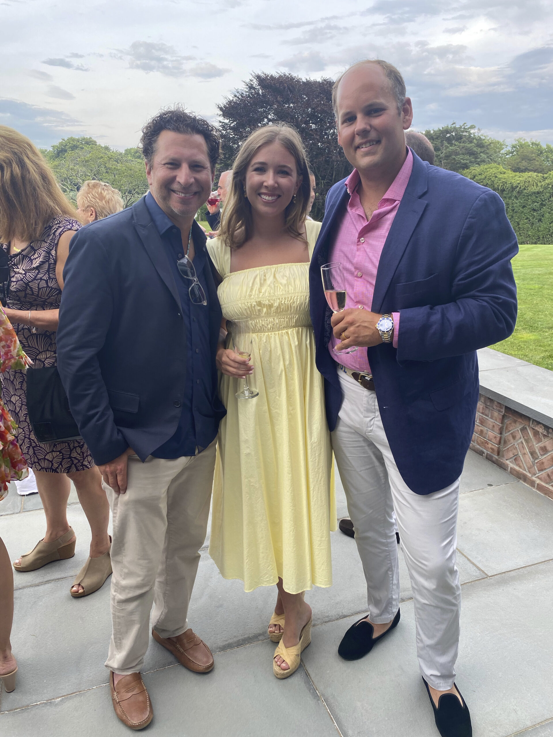 Adam Miller with Haley and Peter Ludlow at the Southampton Hospital kick-off party.   GREG D'ELIA