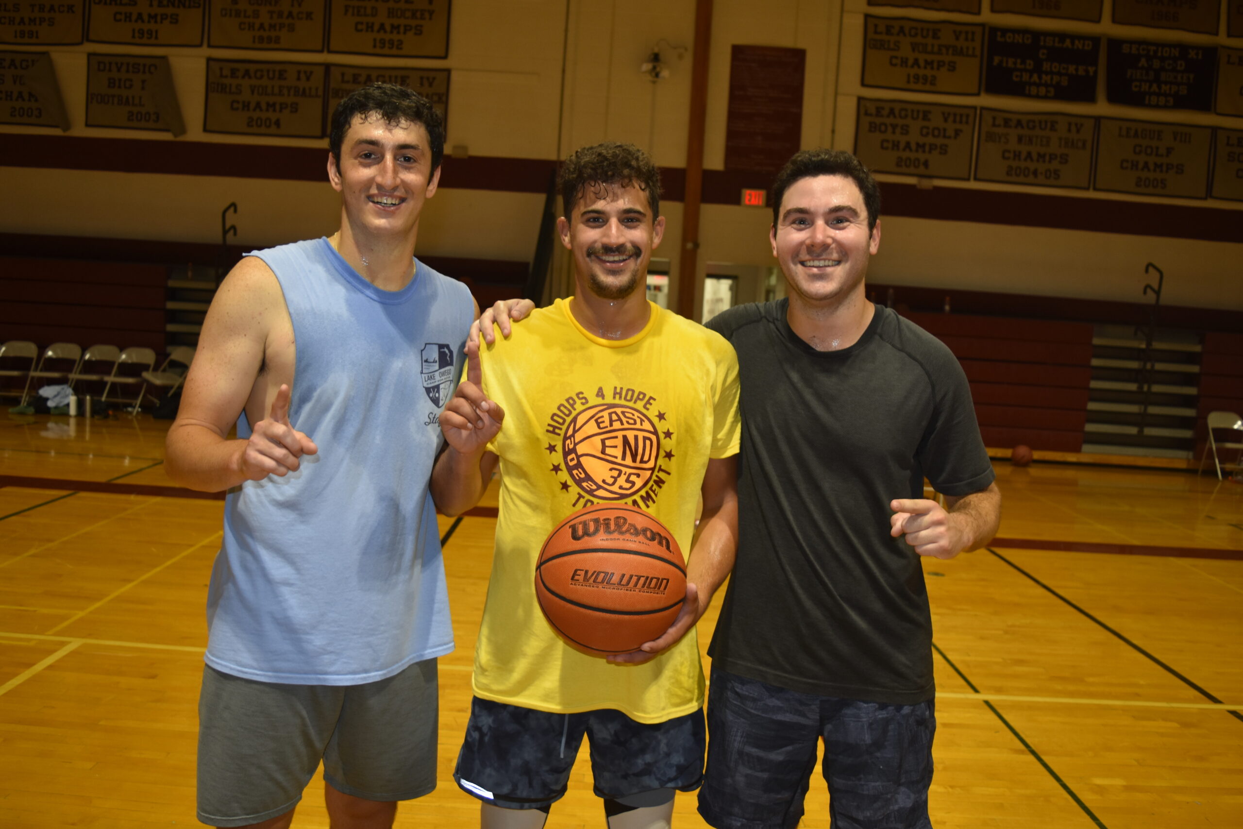 From left, Lawrence Edelstein, Nick Wiener and Ryan Essner were champions of the 18 and over bracket.    DREW BUDD