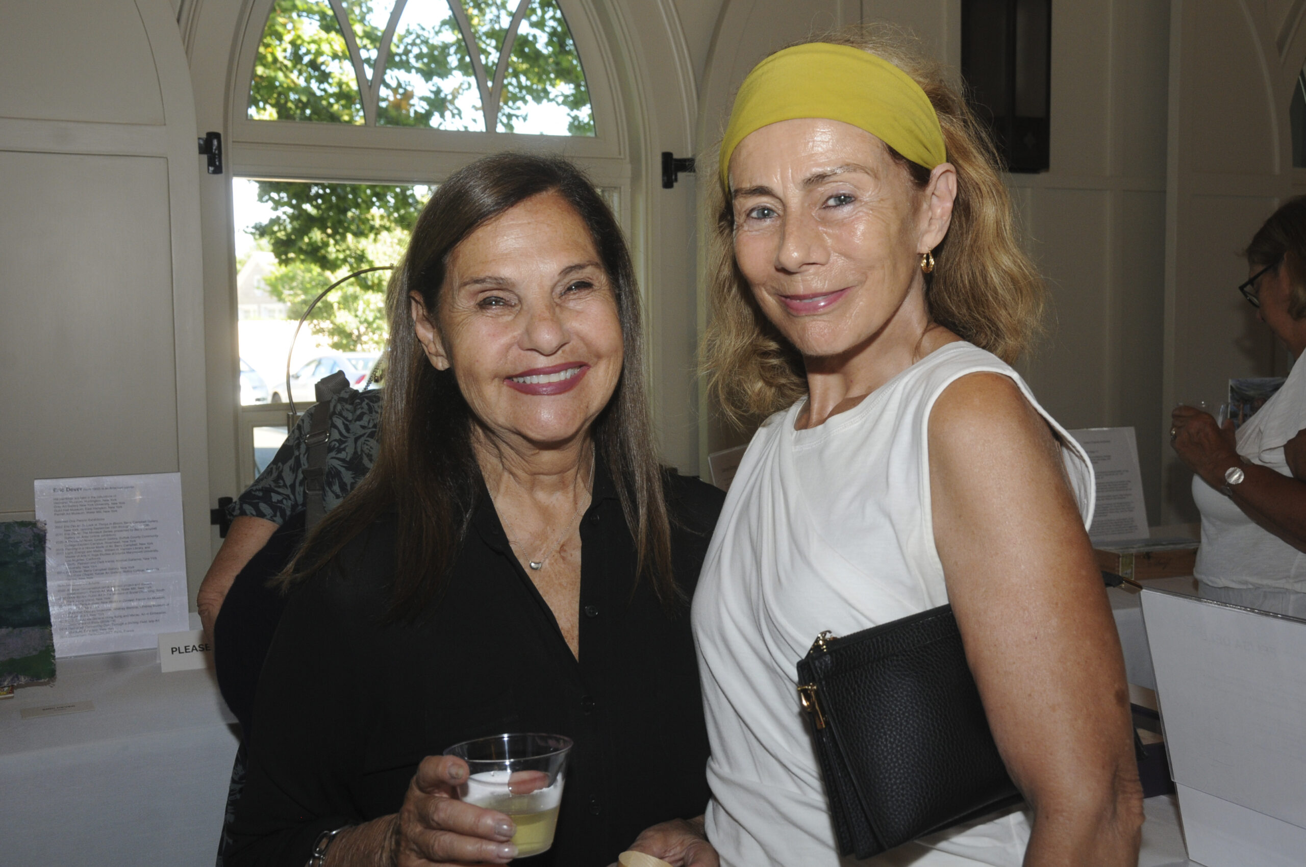 Wendy Israelite and Barbara Layton at the East End Hospice 21st annual Box Art Auction preview reception on August 24 at Hoie Hall at St. Luke's Church in East Hampton . Dozens of local artists contributed their vision and creation of 