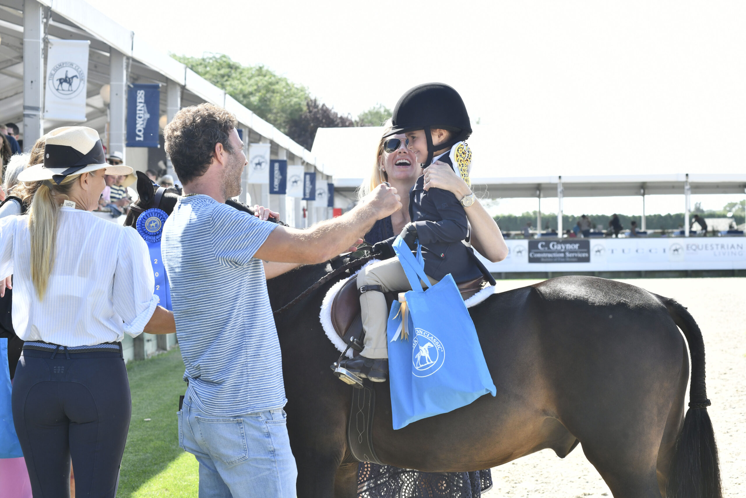 Sienna Pepa is congratulated after earning a fist place spot in the  Leadline 2 to 4-year-old section on Sunday.  DANA SHAW