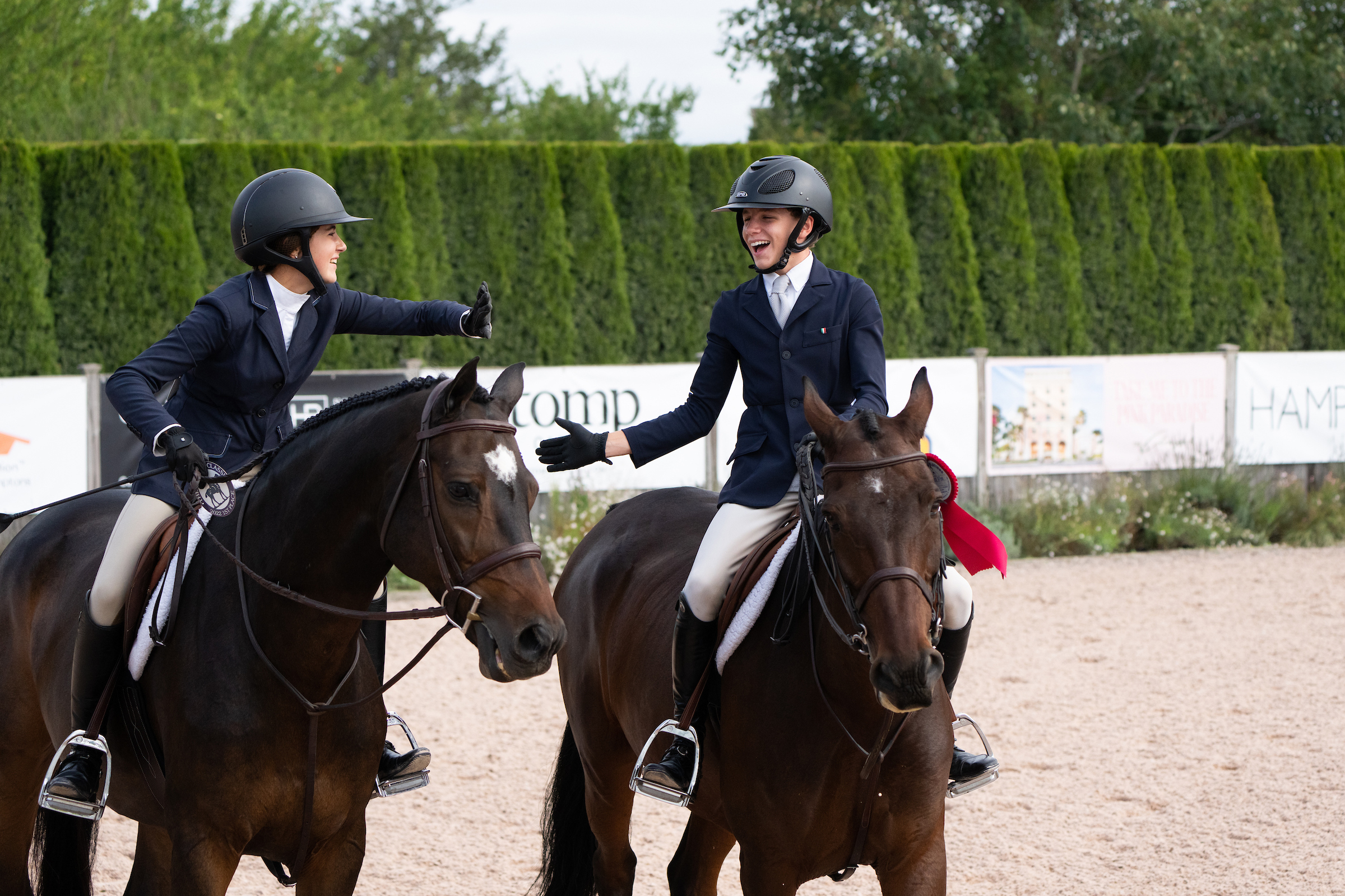 Riders Amelia Burnside and Liam Gaspar, who both train with Erin Stewart of Erin Stewart LLC,  each took home both a blue first-place ribbon and red second-place ribbon in the junior equitation division on Opening Day. LORI HAWKINS