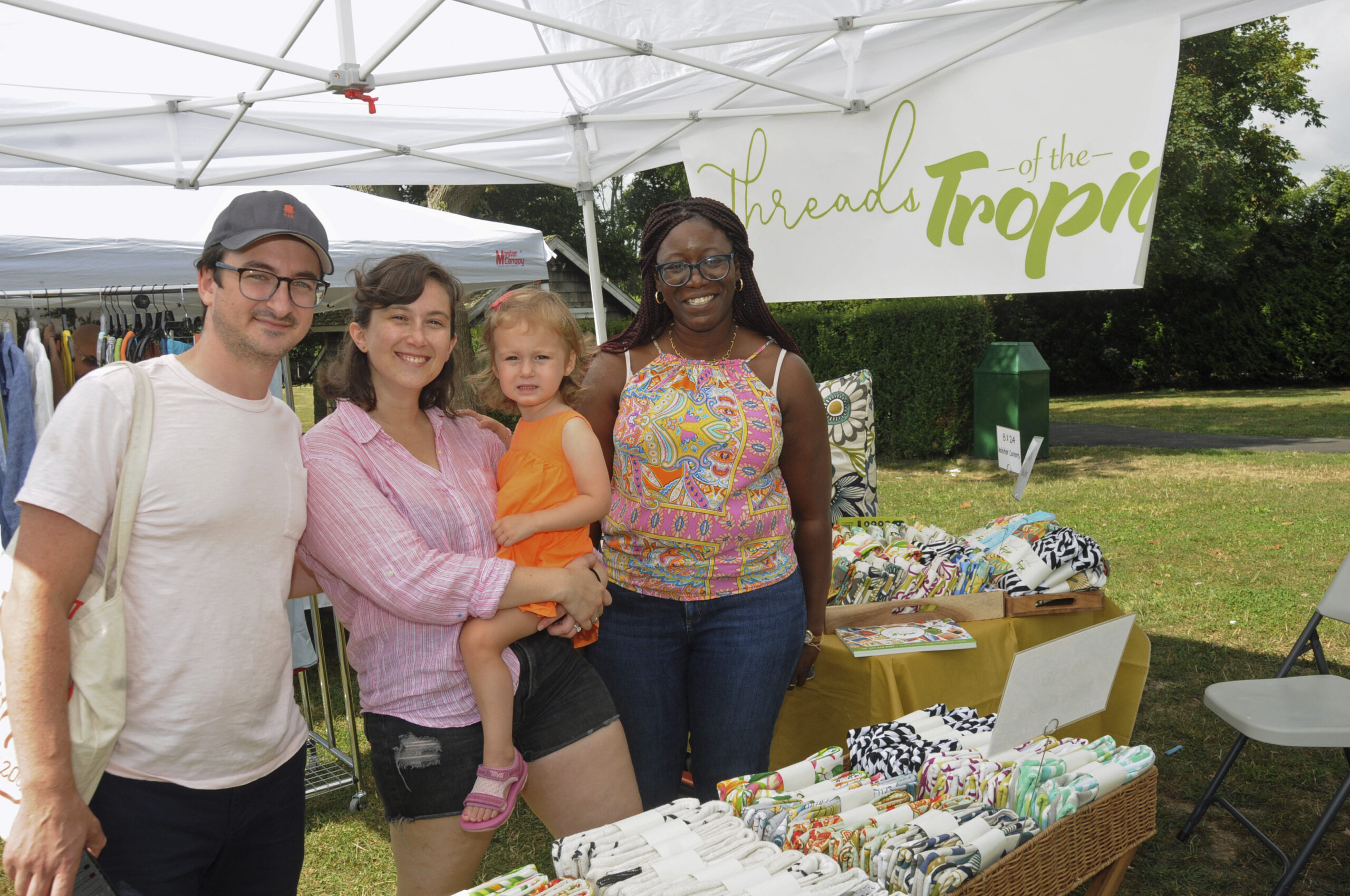 Aaron, Sarah and Mae Phillips with Gail Barry at the East Hampton Chamber of Commerce Summer Festival in Herrick Park in East Hampton on Saturday.  RICHARD LEWIN