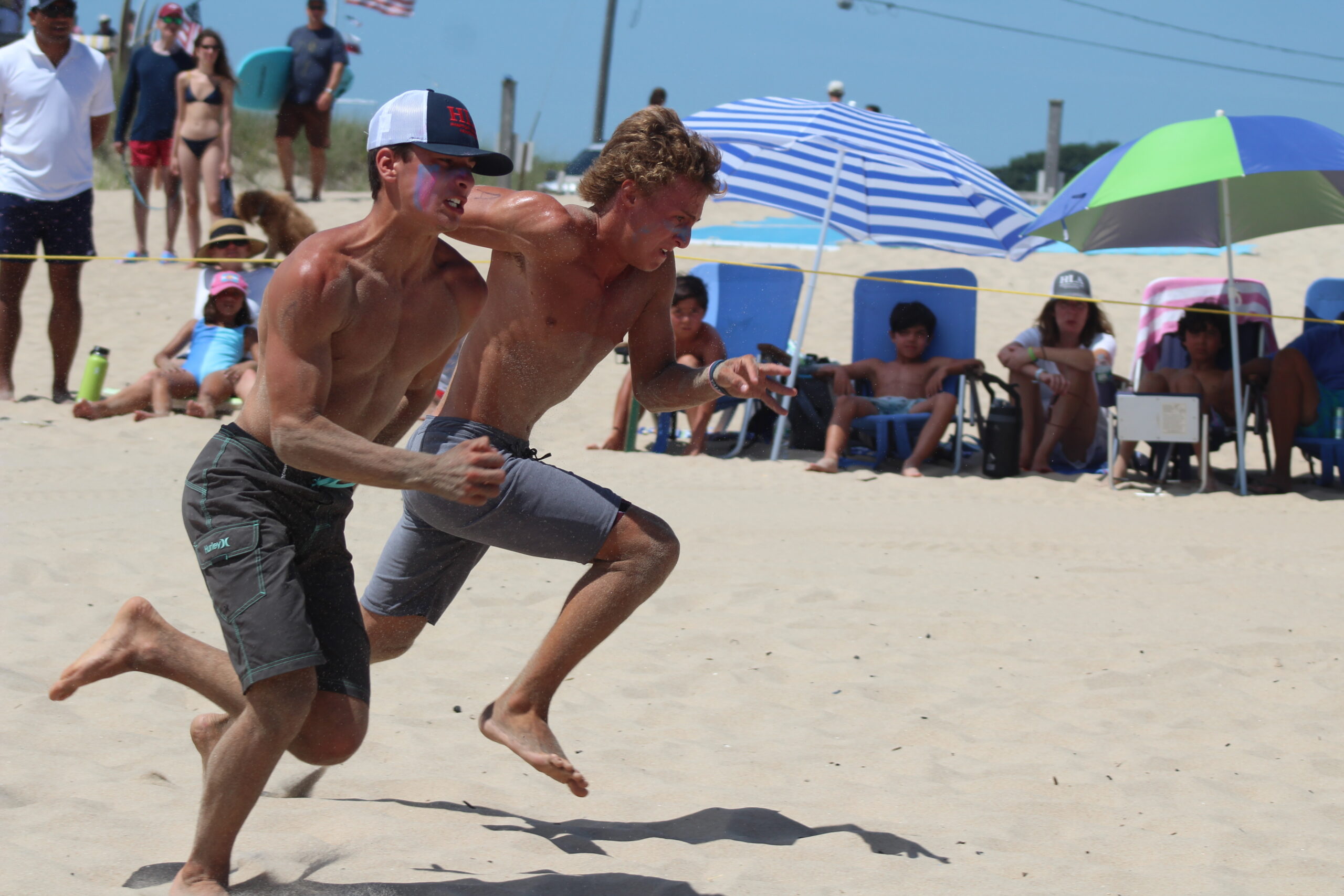 Luke Castillo and Dylan Schmidt race in the finals of the beach flags on Sunday. NICOLE CASTILLO