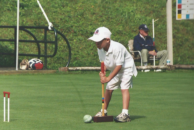Matthew Essick playing croquet at 12 years old.