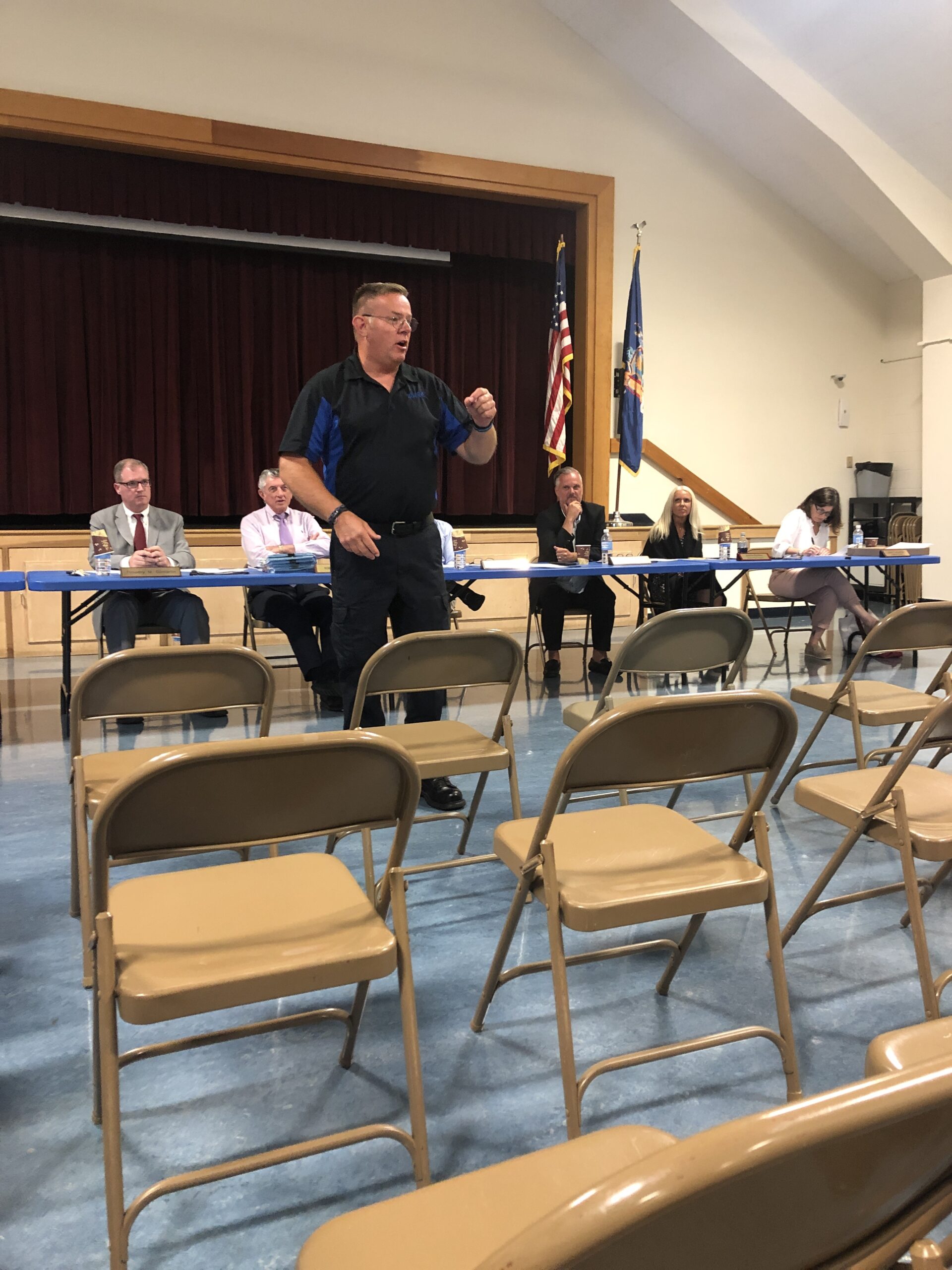 Retired Southampton Town Police Officer Eric Plum spoke to parents at a Tuckahoe School Board meeting on Monday night, sharing his thoughts on what his role would be as an armed security guard for the district. The board approved his hiring and approved having him armed with a gun while serving as a security guard for this upcoming school year. CAILIN RILEY