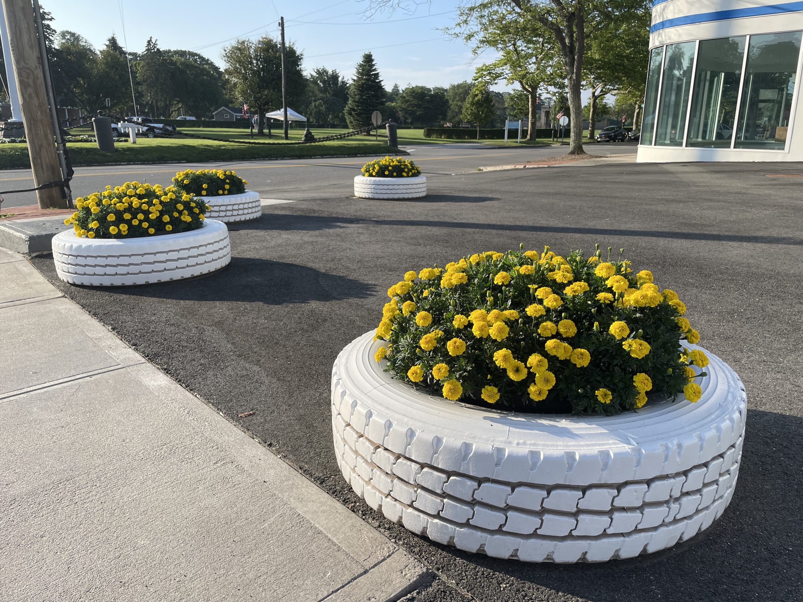 Planter and floral design by Perry Guillot at Christie's in Southampton, in a spot that formerly hosted an auto mechanic.  PERRY GUILLOT