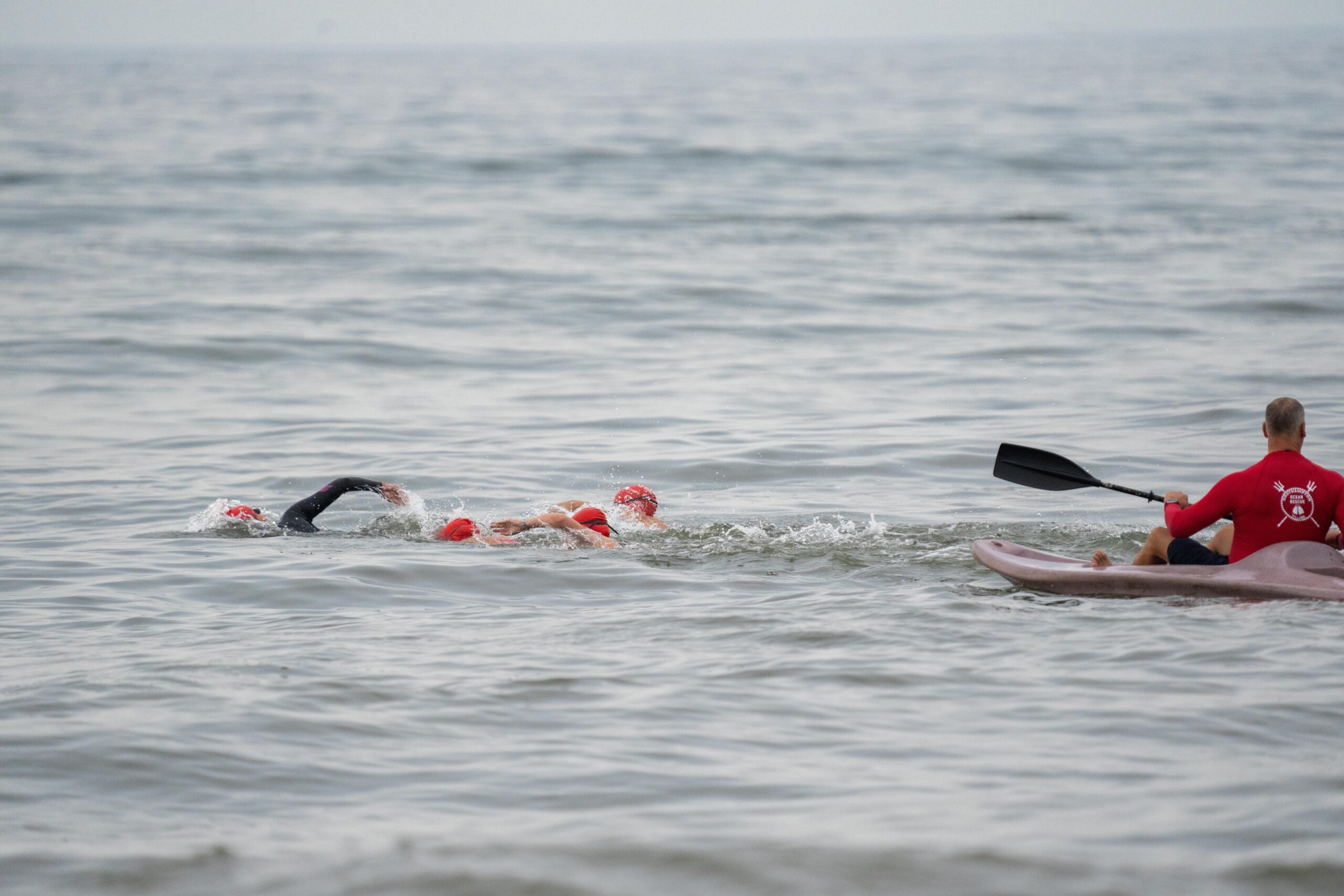 Swimmers jump into the ocean at Coopers Beach on Saturday morning for the first ever S-Mile Swim Challenge hosted by Southampton Village Volunteer Ocean Rescue.    RON ESPOSITO