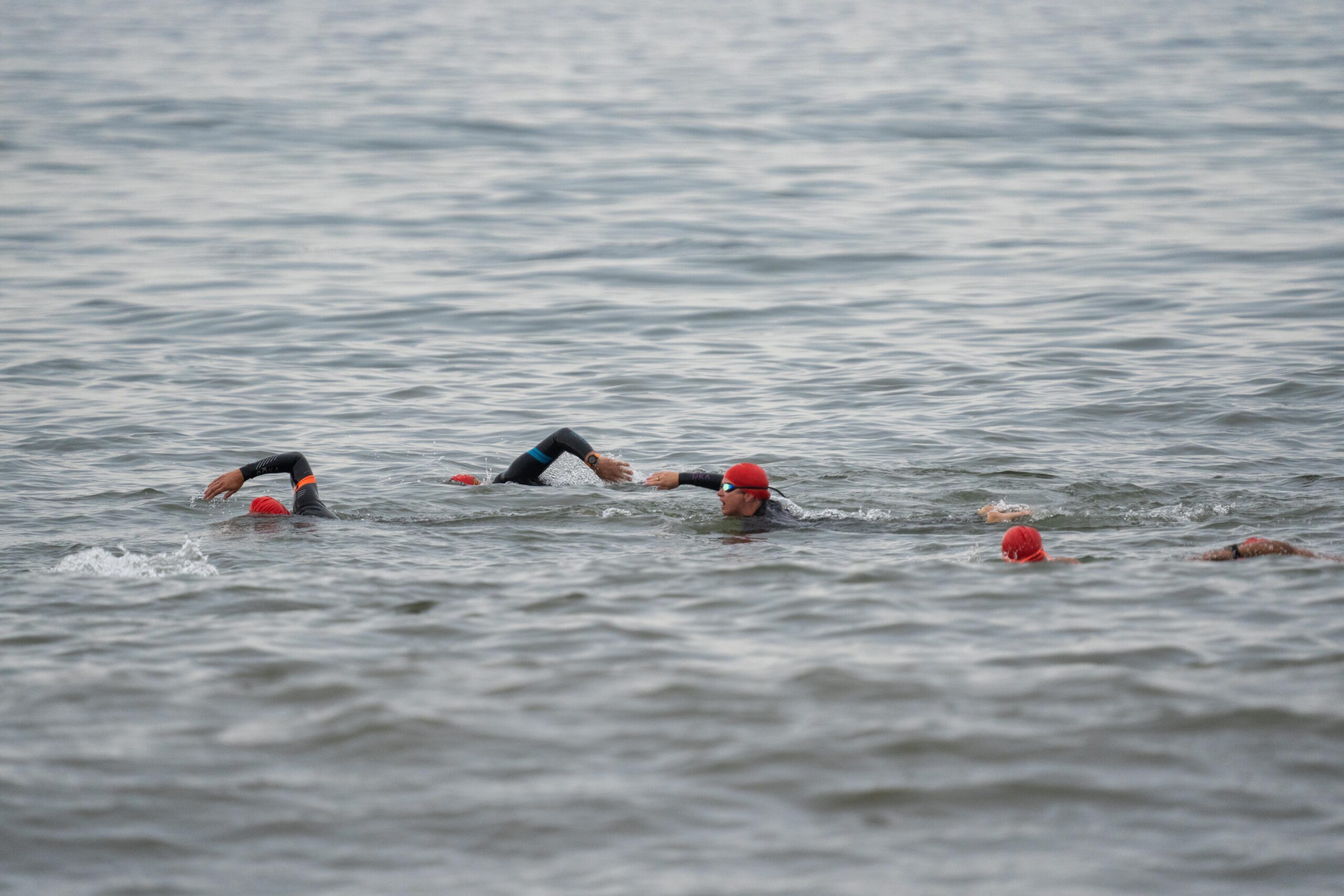 Swimmers jump into the ocean at Coopers Beach on Saturday morning for the first ever S-Mile Swim Challenge hosted by Southampton Village Volunteer Ocean Rescue.    RON ESPOSITO