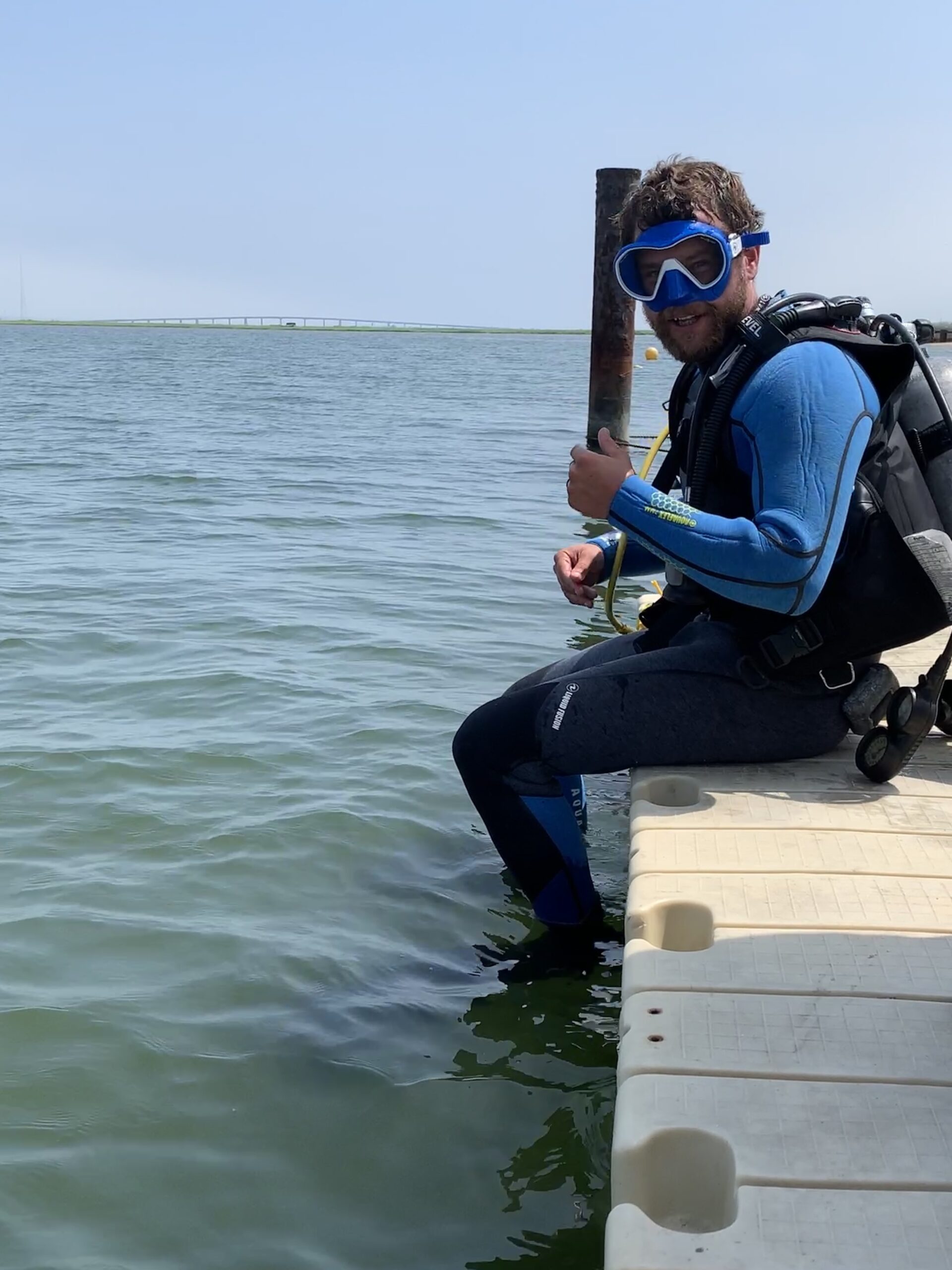 Harrison Tobi is leading the Cornell Cooperative Extension's monitoring of bay scallop populations in the Peconics, which appear headed for another massive die-off before the fall harvest.