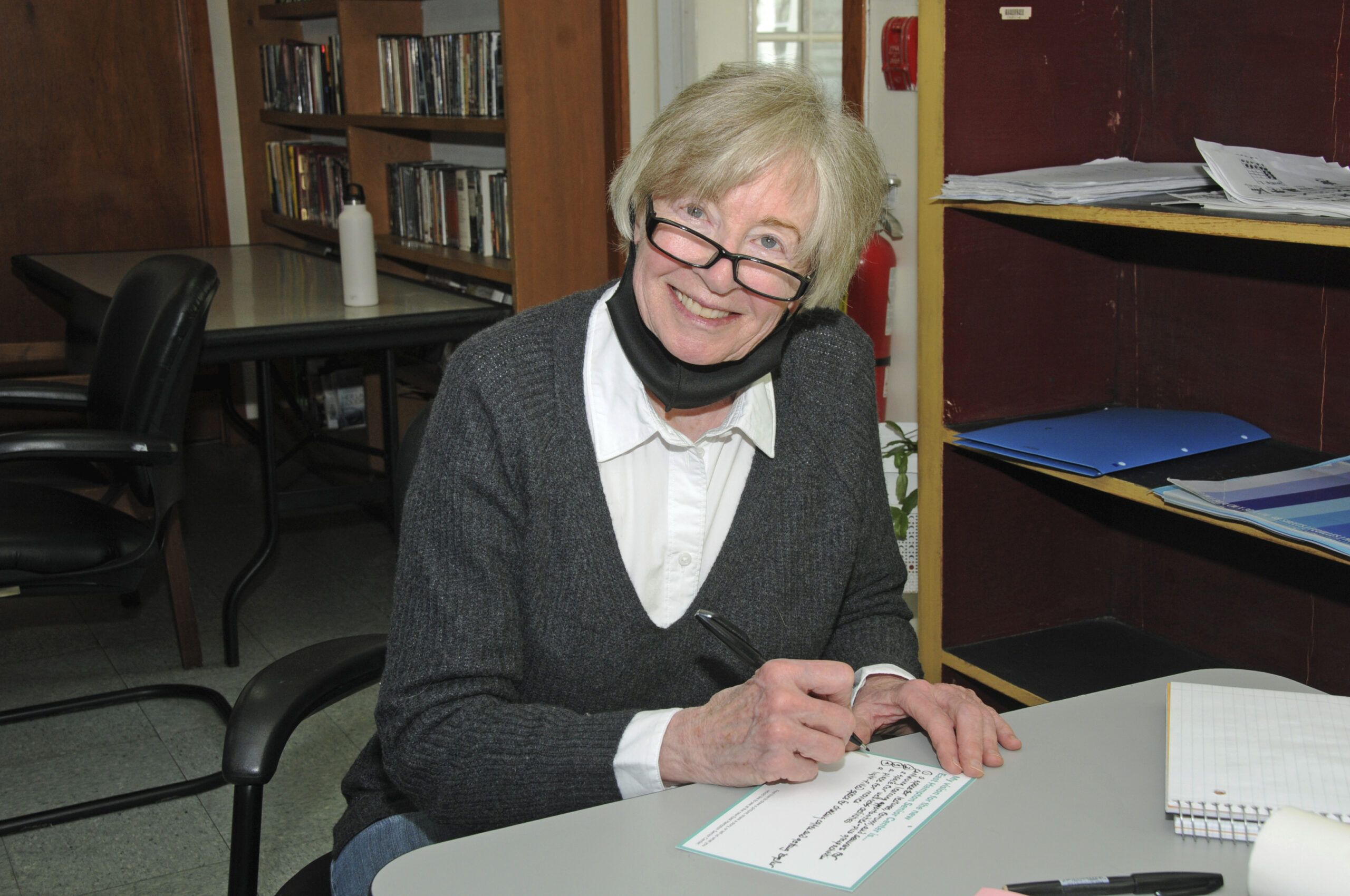 Pamela Bicket writes out her suggestions for the senior center at a public meeting in May.  RICHARD LEWIN