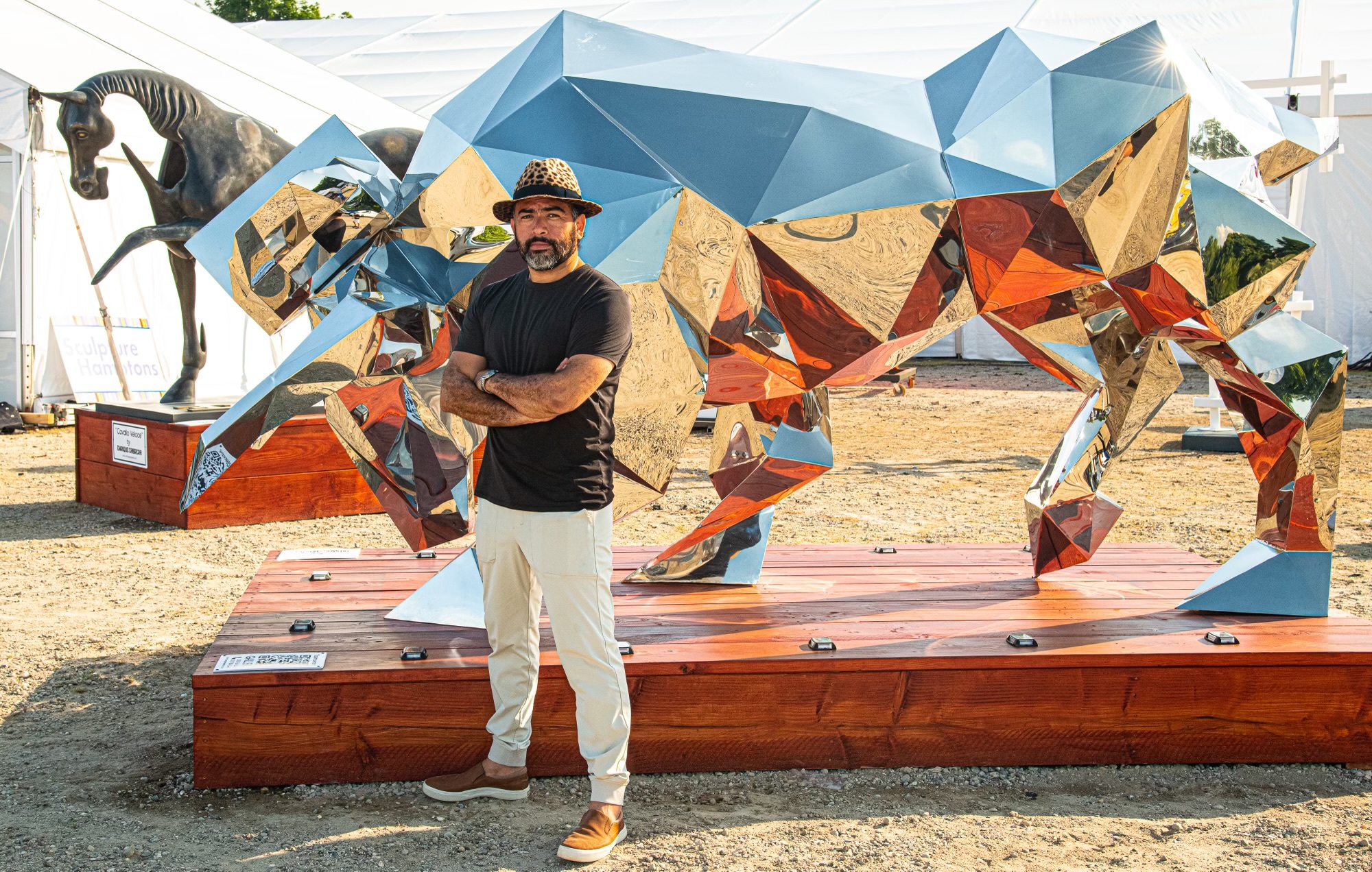 Enrique Cabrera with his stainless steel sculpture 