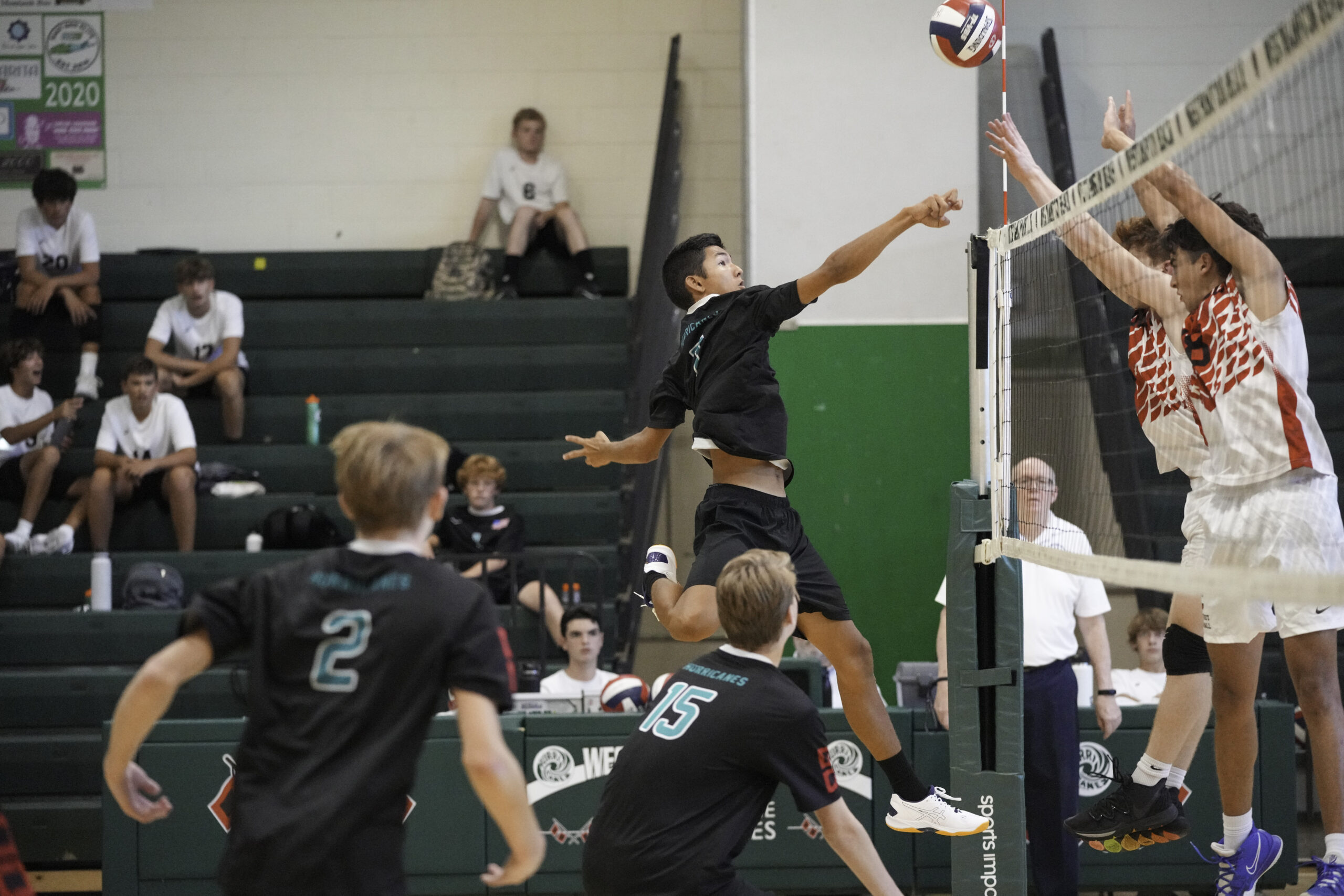 Junior outside hitter Alec Kelly spikes the ball. RON ESPOSITO