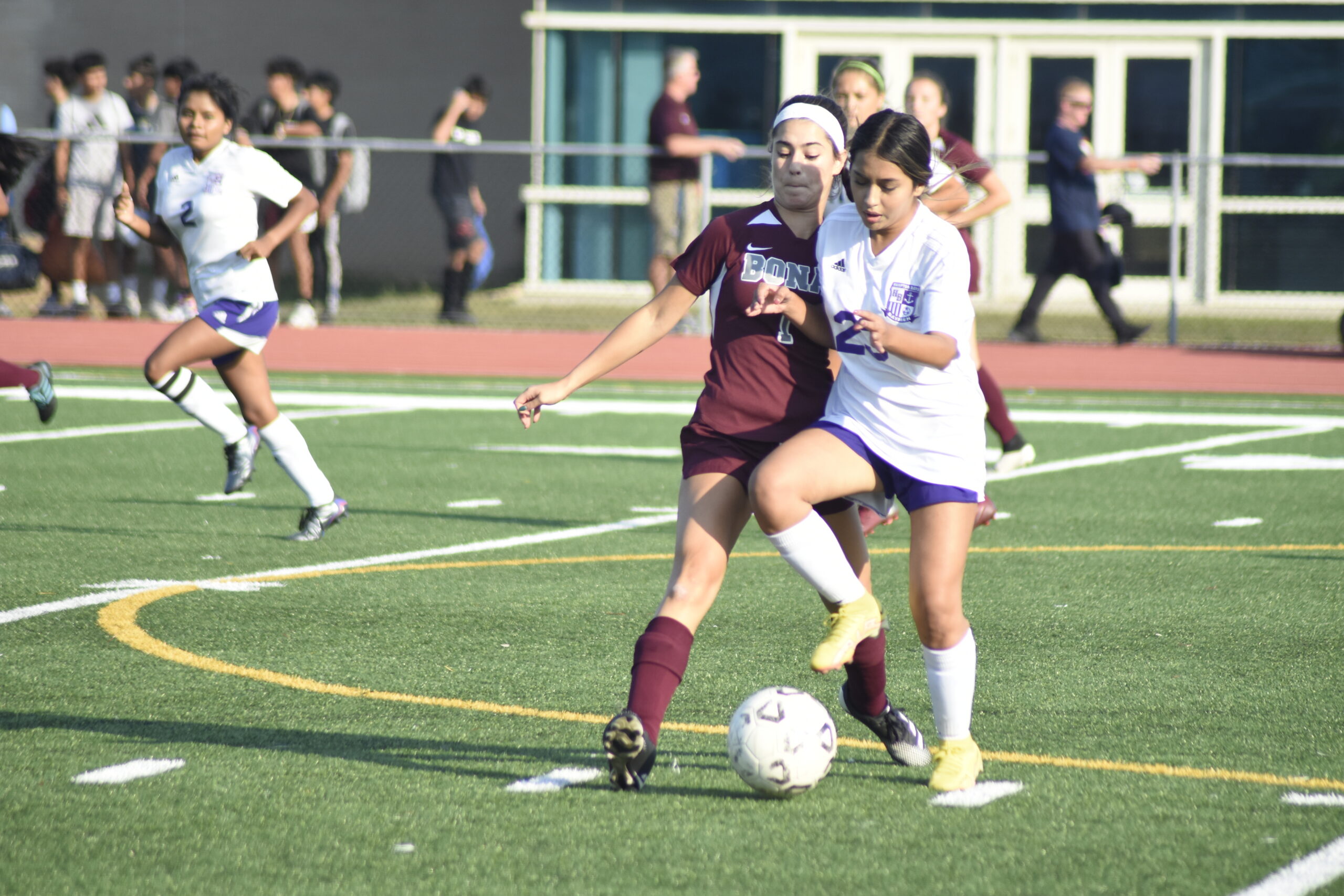 Pierson sophomore Wyeth Zeff pressures Hampton Bays junior Jessenia Maldonado.   DREW BUDD