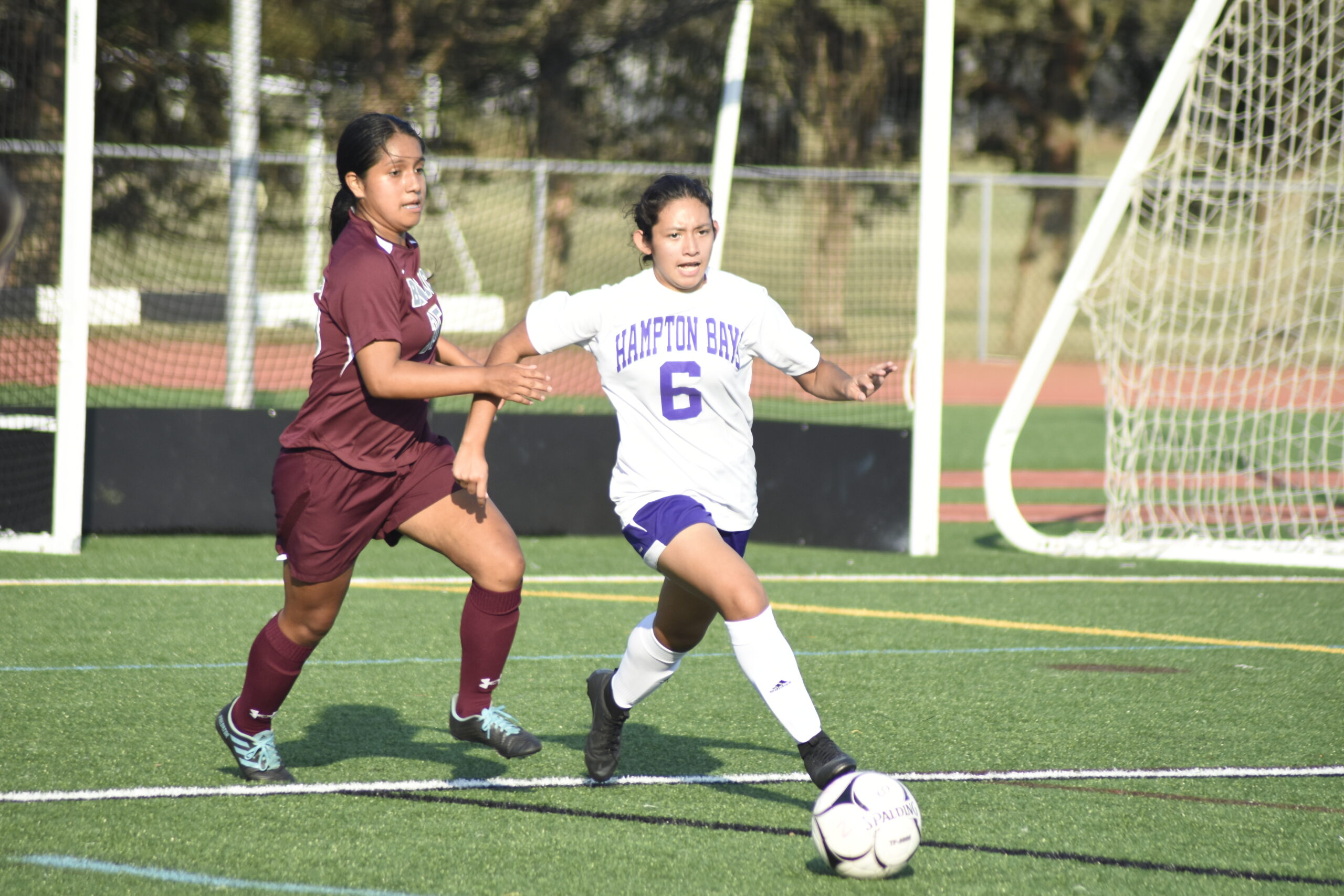 Hampton Bays senior Stephanie Caal gets away from an East Hampton player.    DREW BUDD