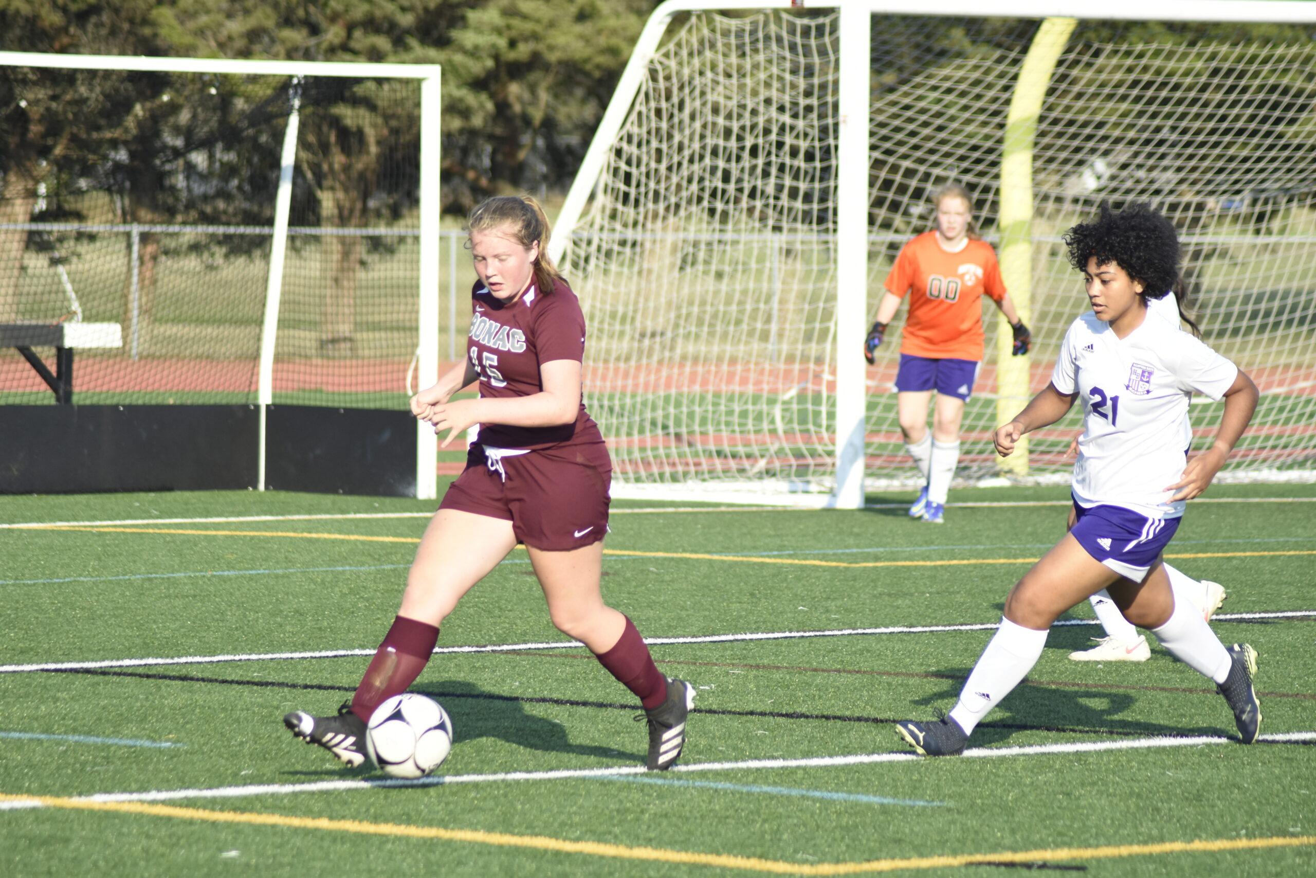 East Hampton senior Claire McGovern plays the ball deep into Hampton Bays territory.    DREW BUDD