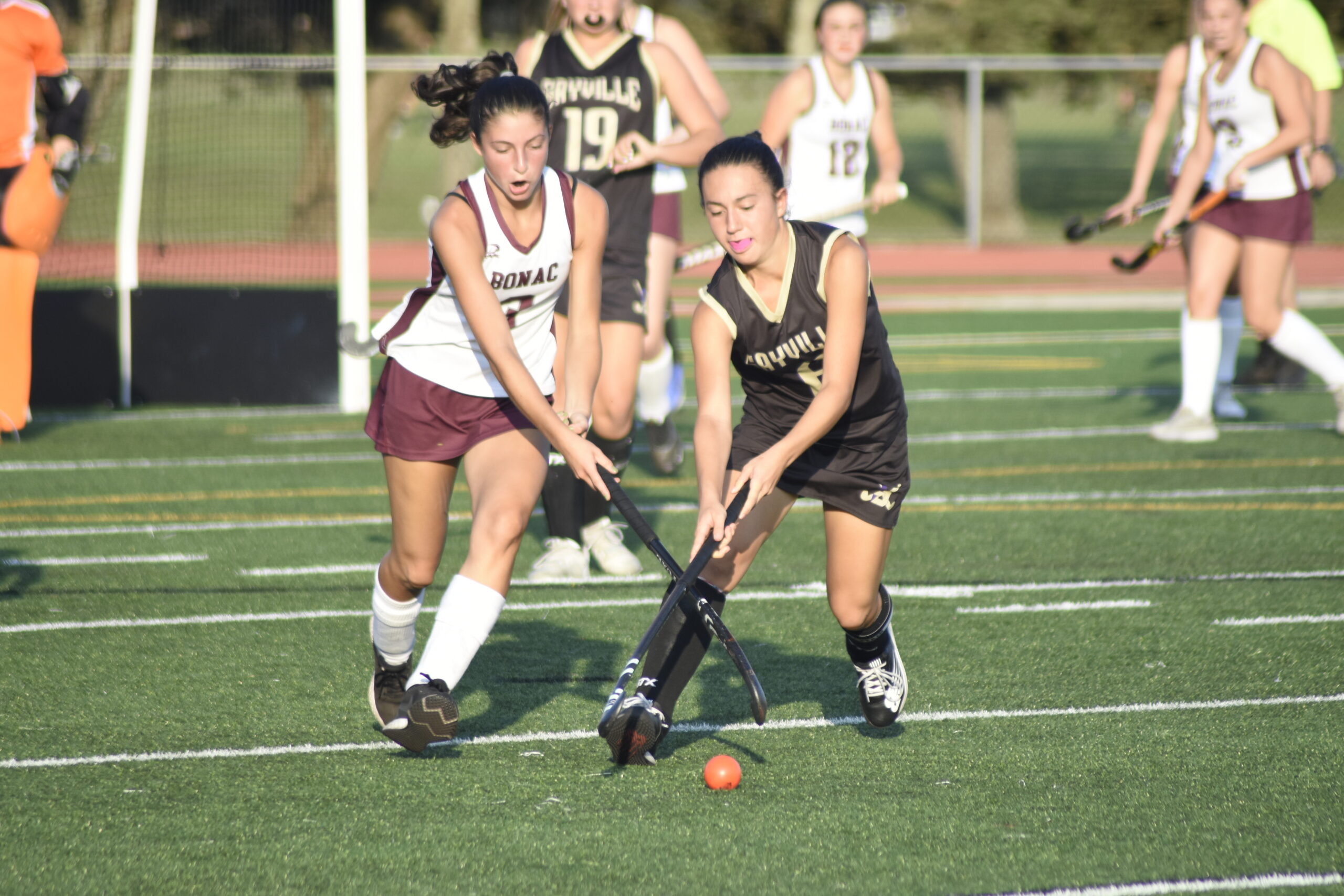 East Hampton junior Sienna Link Morse and a Sayville player go after the ball.    DREW BUDD