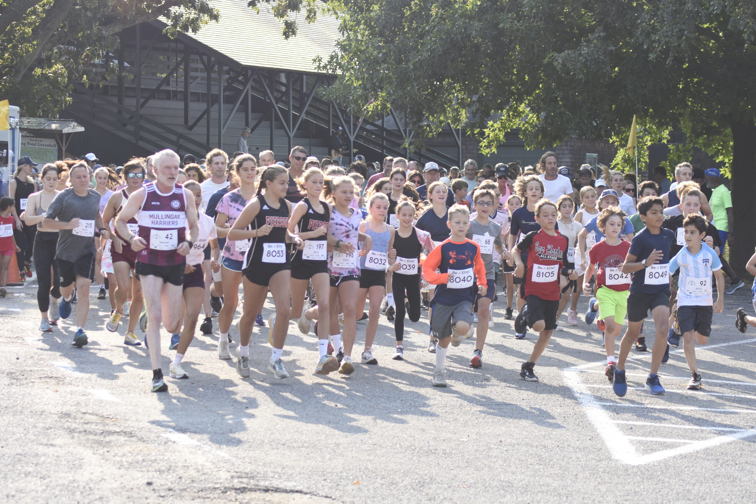 Runners and walkers start the second annual Mashashimuet Park Friends and Family 5K on Sunday morning.    DREW BUDD