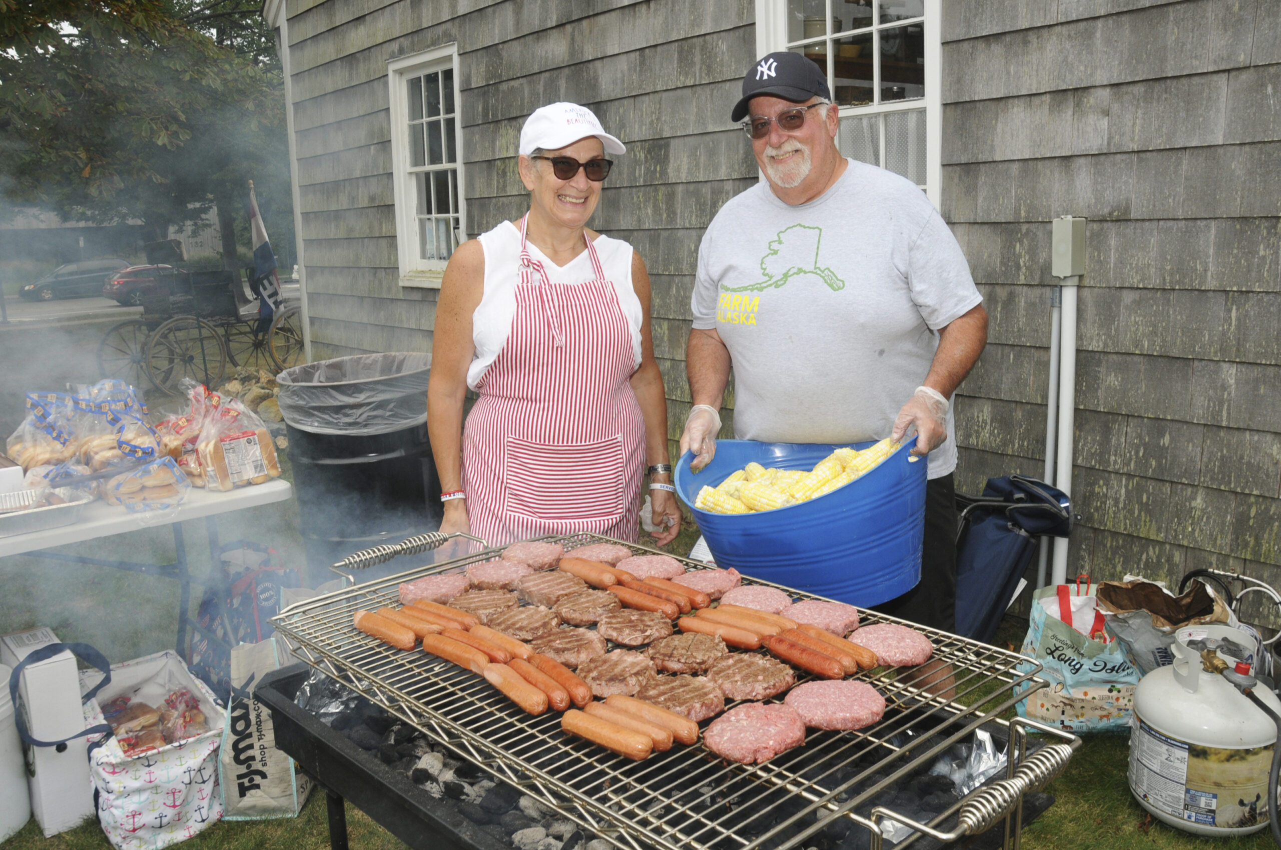 Tony and Patty Sales at the Bonac BBQ at the East Hampton Historical Farm Museum on North Main Street on Sunday. Everything was locally sourced Bistrian corn, Accabonac Farm burgers and hot dogs, locally grown melons and music by Chart Guthrie's 