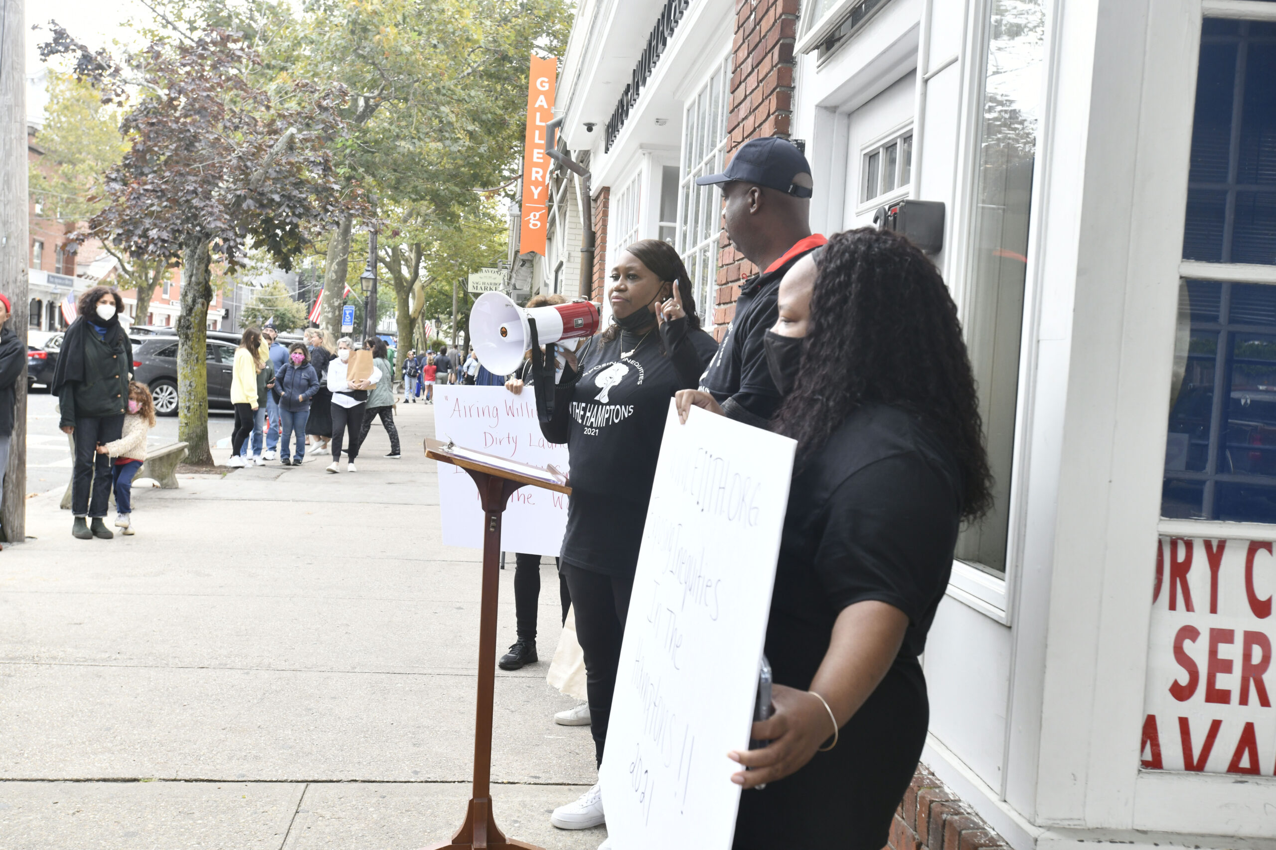 Tanya Dawson, Nia Dawson's mother, recounts details of the incident while standing in front of the launderette as part of a peaceful protest organized by Exposing Inequities in the Hamptons in October 2021.  DANA SHAW