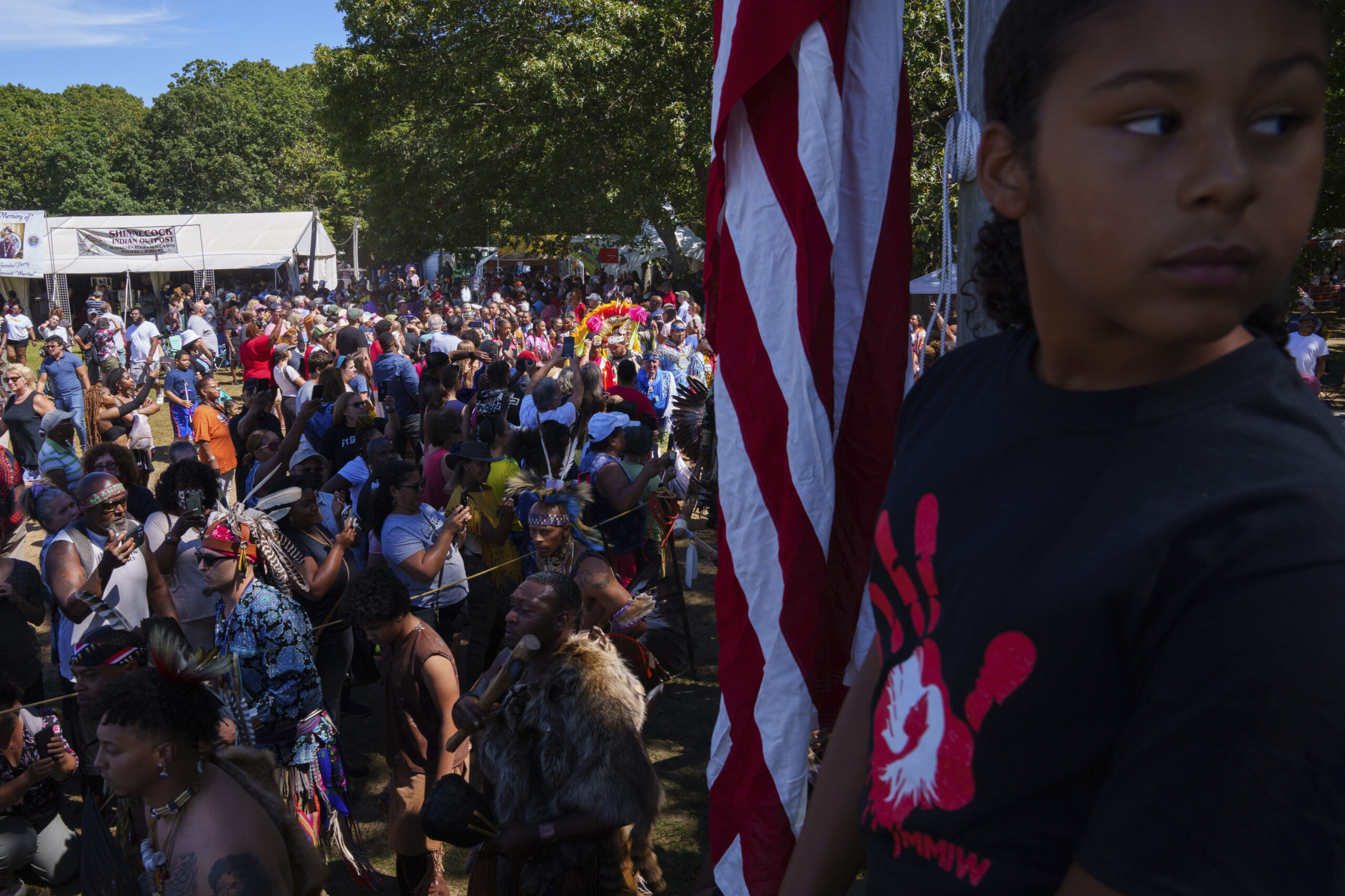 A girl attending the Shinnecock Nation powwow wears a shirt to bring awareness to MMIW - Missing and Murdered Indigenous Women.