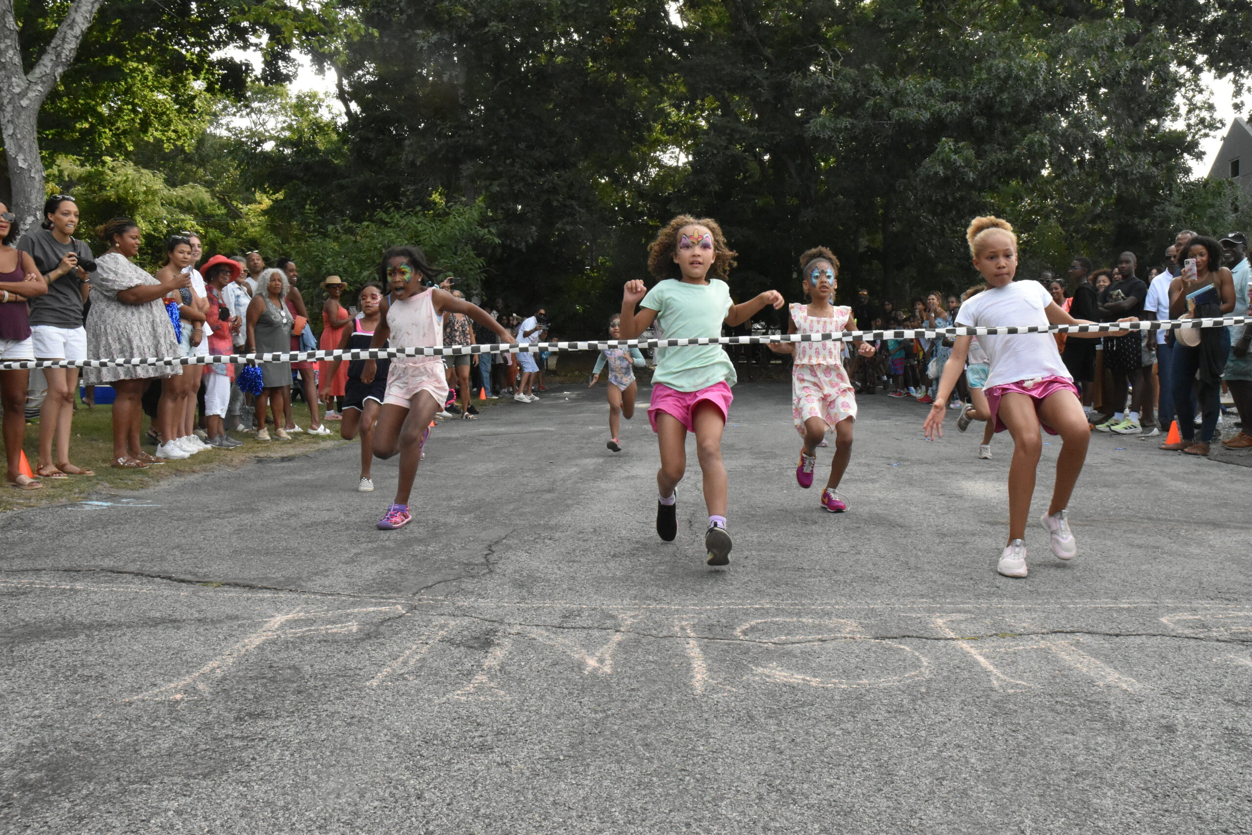 As they do every year, children from 3 to college age, take part in races along Ninevah Place. The distance is extended for each age group. STEPHEN J. KOTZ