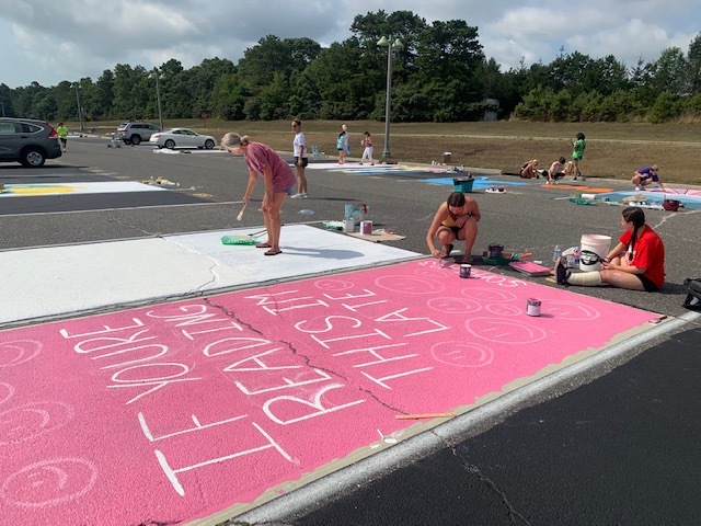 Eastport-South Manor Junior-Senior High School seniors marked their parking spots with
creatively painted illustrations during the school’s annual Paint Day. After submitted
illustrations were approved, the students gathered in the parking lot to paint their assigned spaces for a fee. The fees collected will be placed in the seniors’ activity fund and earmarked for the senior prom next spring. COURTESY EASTPORT-SOUTH MANOR SCHOOL DISTRICT