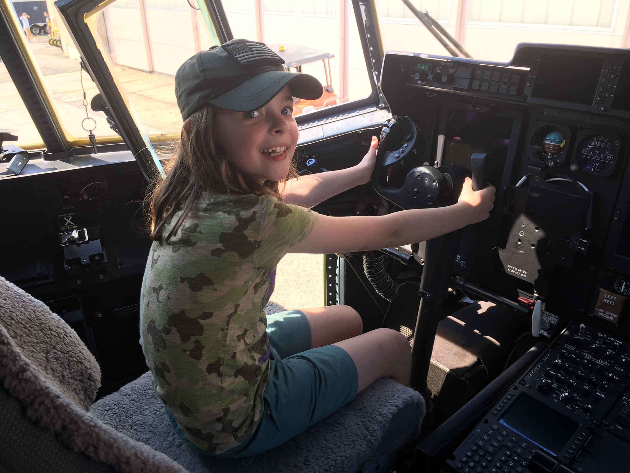 Taking control in the cockpit of the HC-130J Combat King during the 106th Rescue Wing family day at Gabreski Airport.     KITTY MERRILL