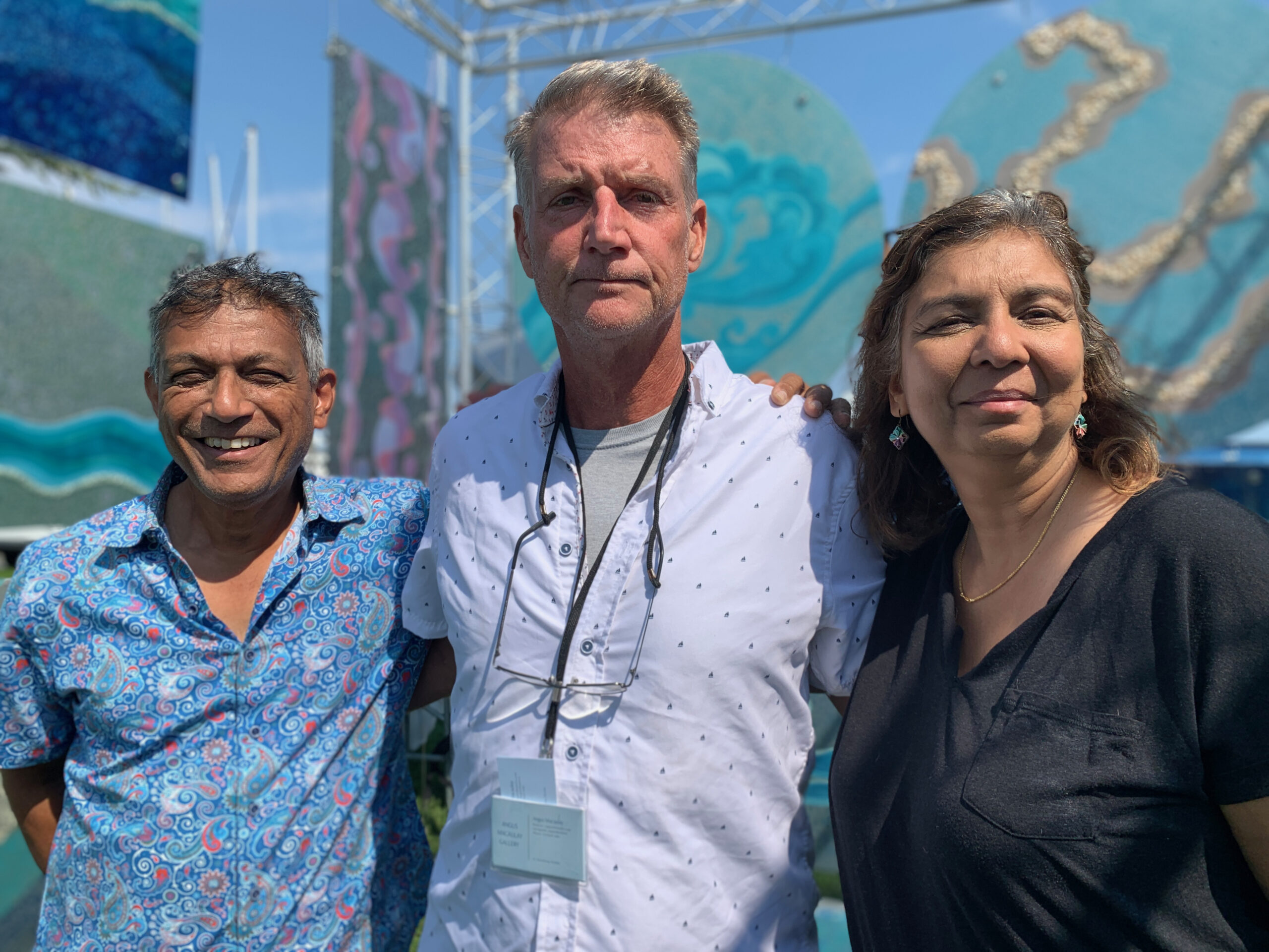 Artists Sanjib Mallik, Angus Macaulay and Kavita Mallik at the Arts and Crafts Fair held during HarborFest weekend in Sag Harbor. ANNETTE HINKLE
