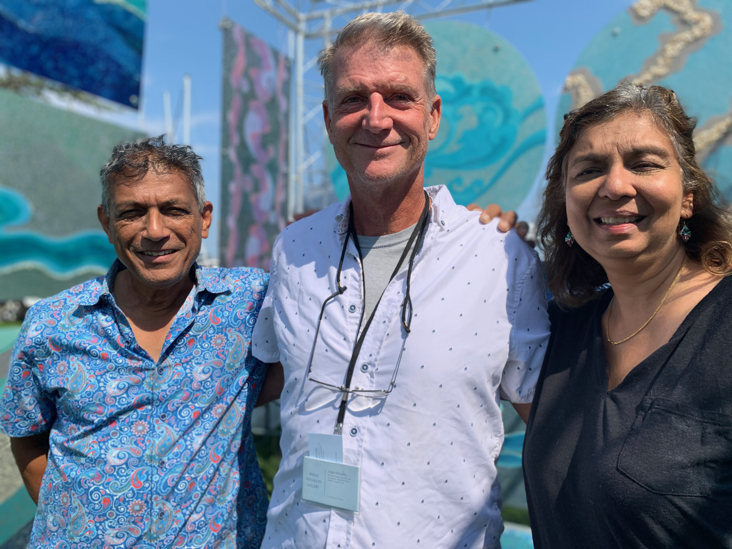 Artists Sanjib Mallik, Angus Macaulay and Kavita Mallik at the Arts and Crafts Fair held during HarborFest weekend in Sag Harbor. ANNETTE HINKLE