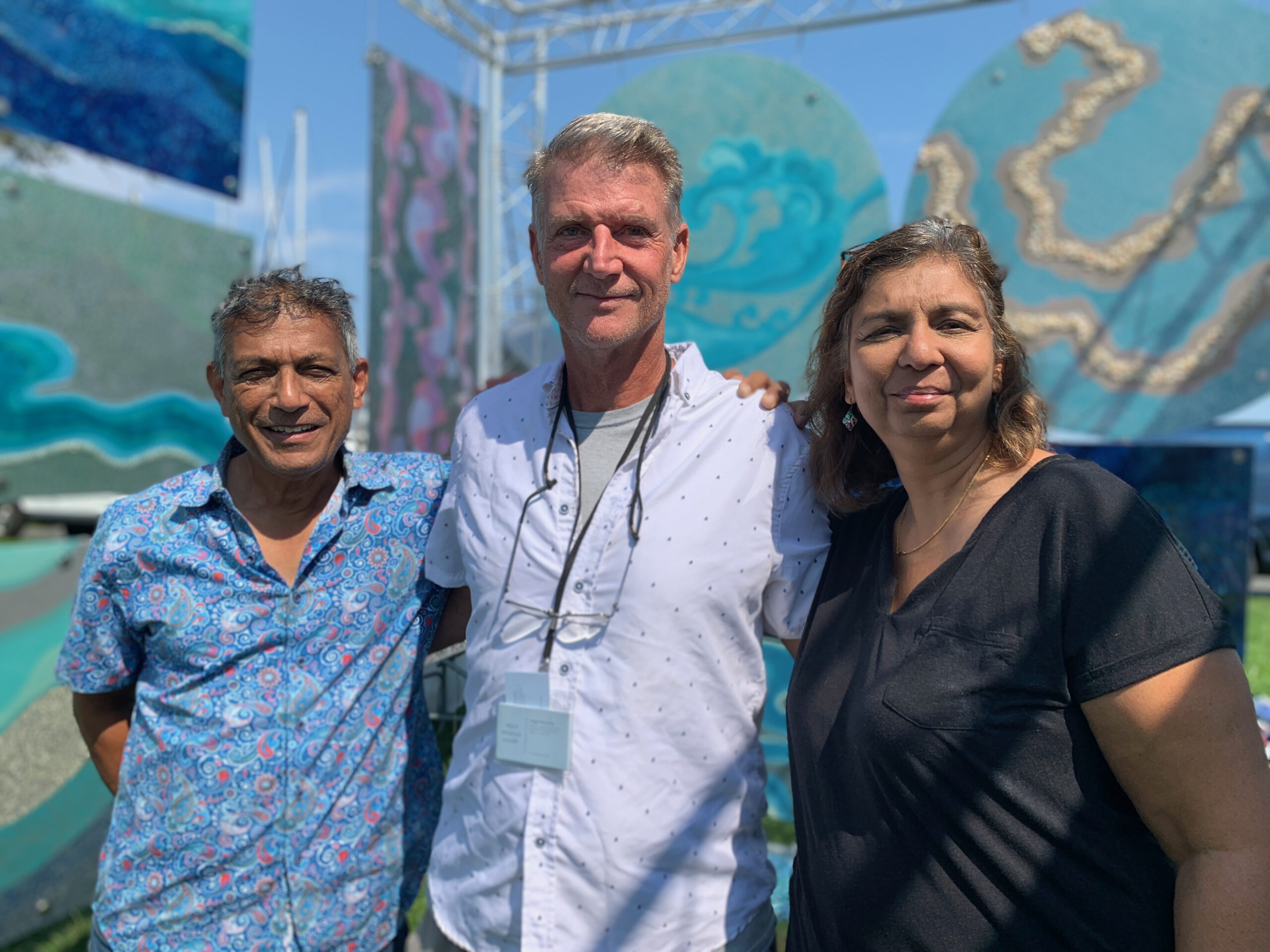 Artists Sanjib Mallik, Angus Macaulay and Kavita Mallik at the Arts and Crafts Fair held during HarborFest weekend in Sag Harbor. ANNETTE HINKLE