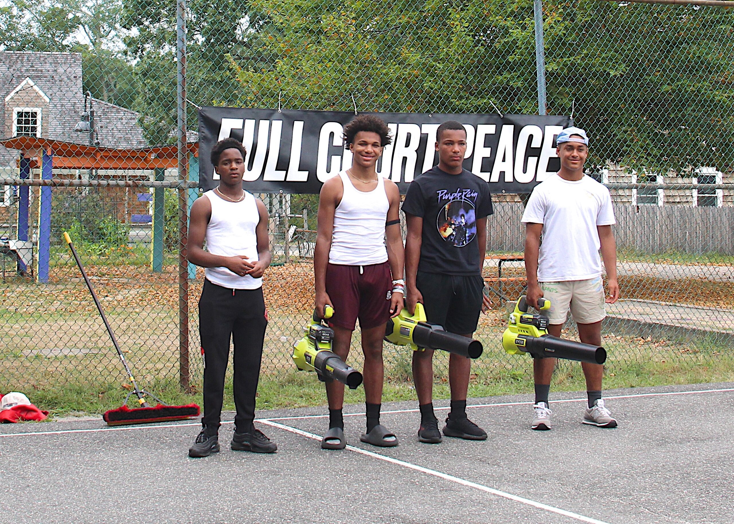 Bridgehampton School basketball players, from left, Marqueese Thomas, Jai and Mikhail Feaster and Alex Davis, were all at the court on Sunday helping with the makeover.   KYRIL BROMLEY