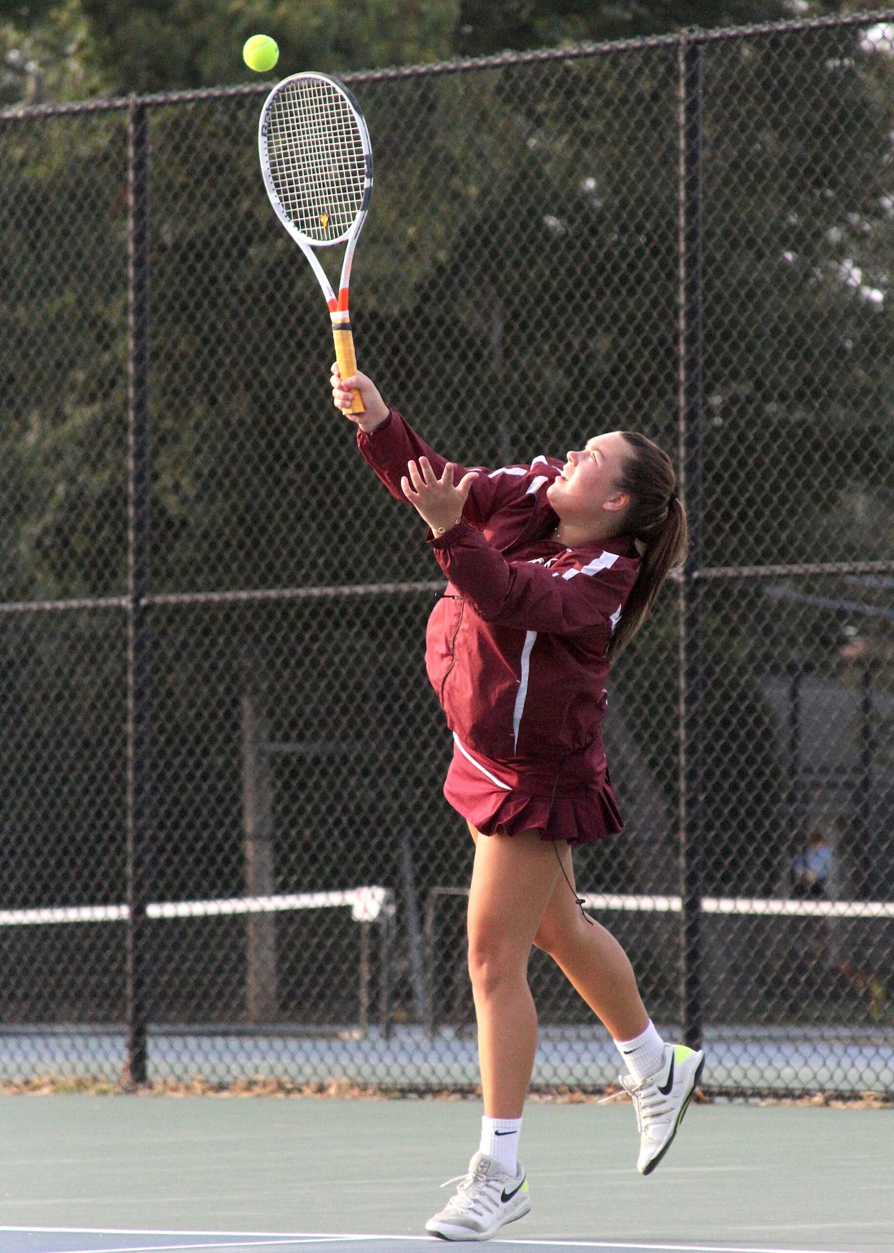 East Hampton's Lily Somers serves up the ball at No. 1 doubles. DESIRÉE KEEGAN