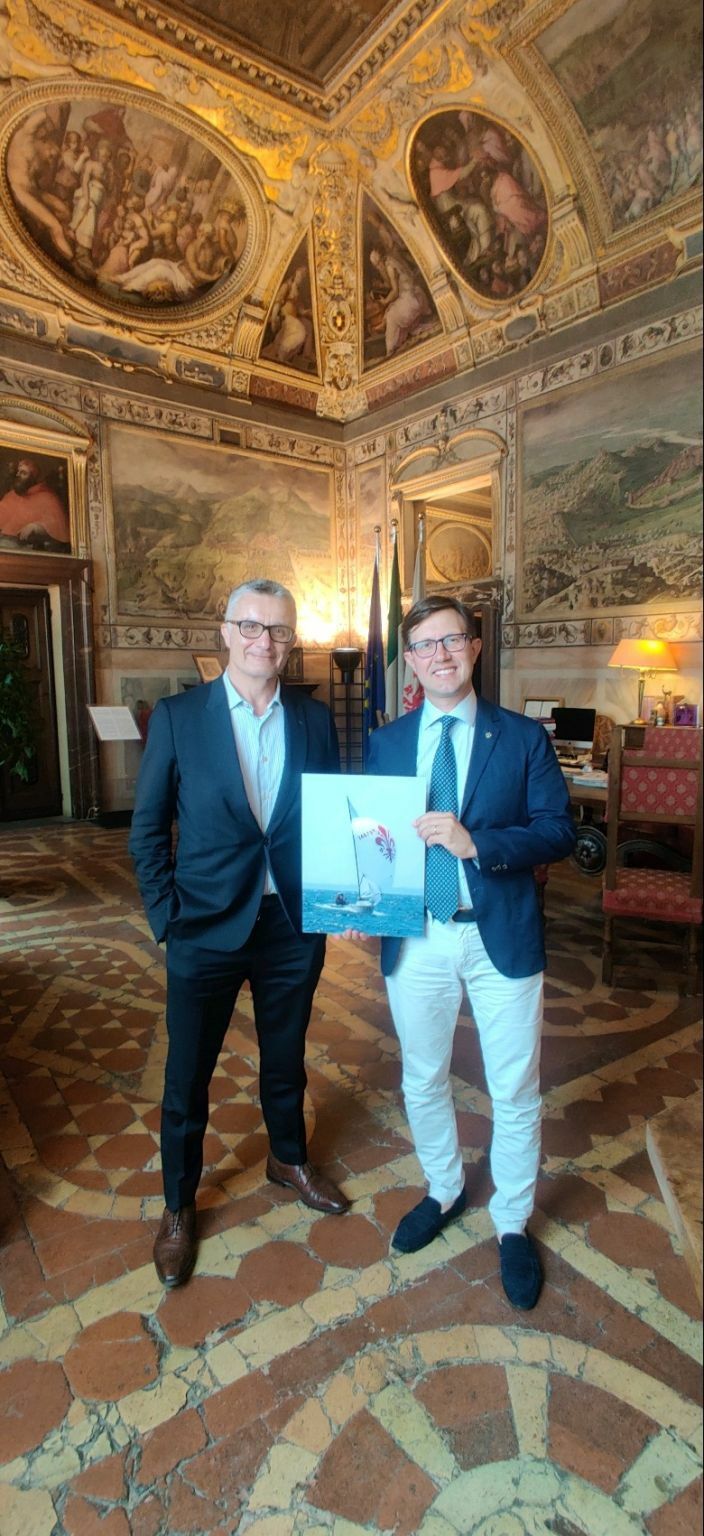 The Rulli family gifted an NFT, or non-fungible token, to Giglio Mondiale, the mayor of Florence, Italy. The NFT is a photo of the Rulli family lighting boat, with the spinnaker sporting the Fleur-de-lis, or lily of Florence, a 2,000-year-old symbol.