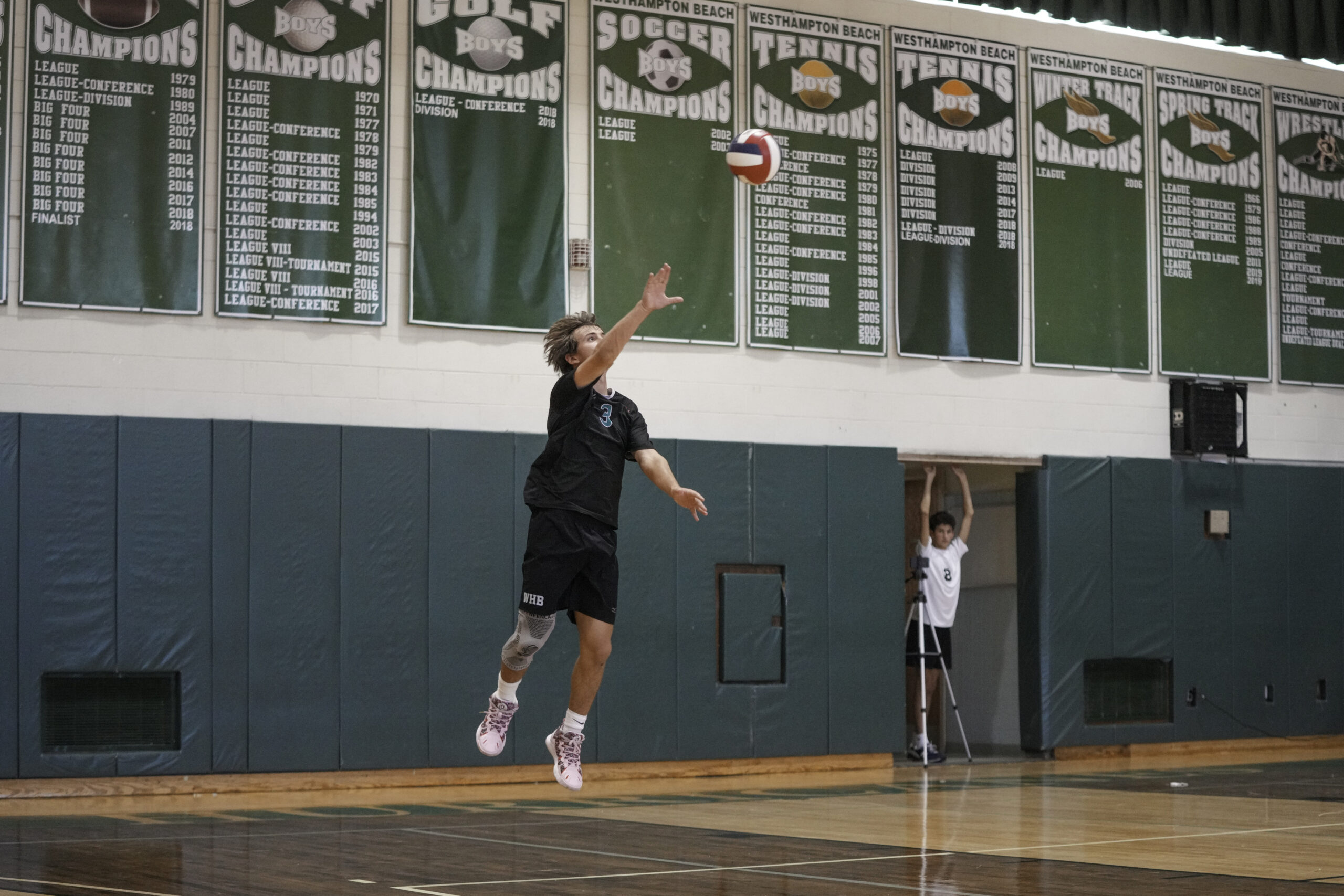 Junior setter Seth Terry serves. RON ESPOSITO