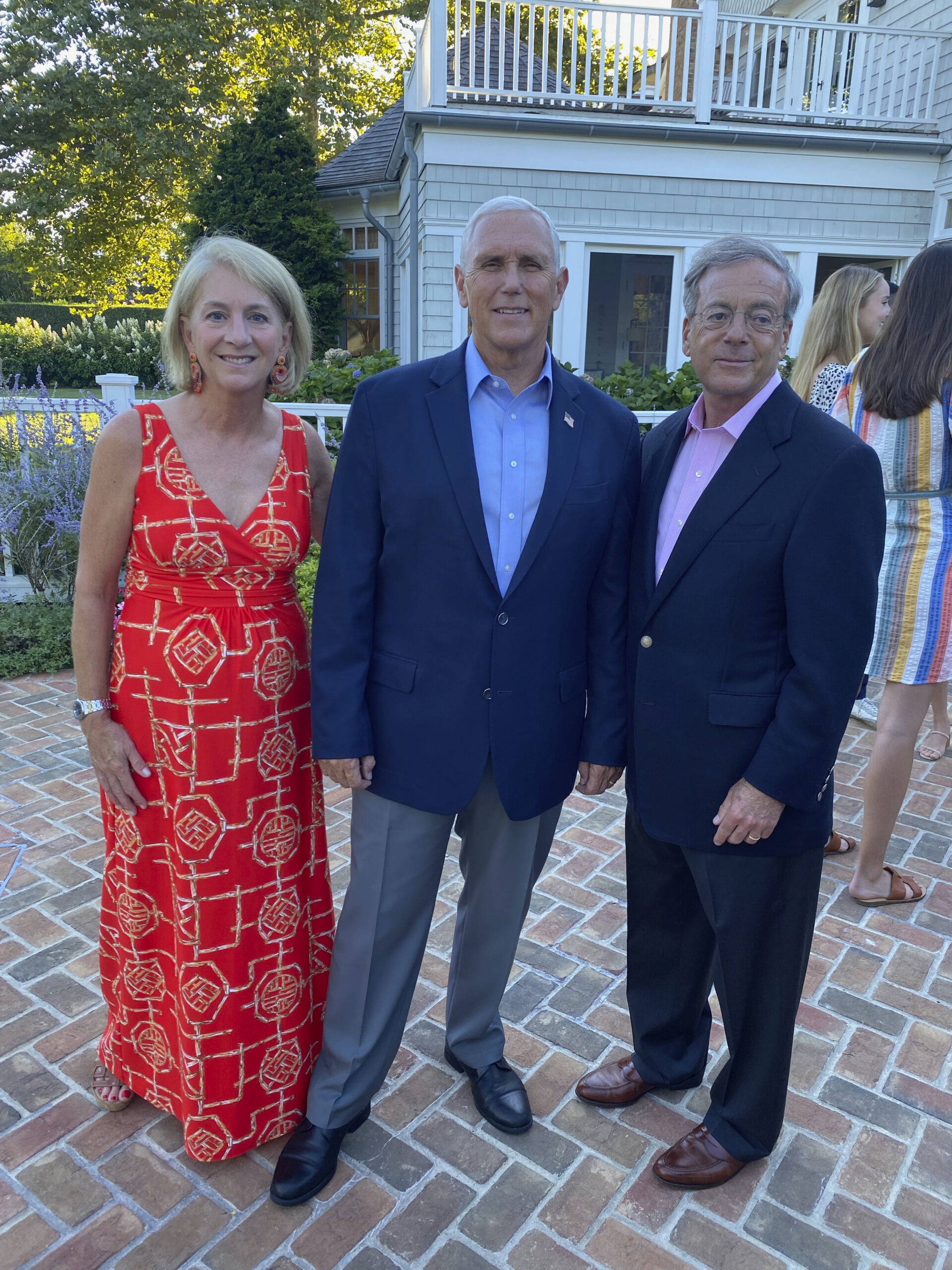 Amy and Sid Goodfriend with former Vice President Mike Pence, center, at a private cocktail party.  GREG D'ELIA