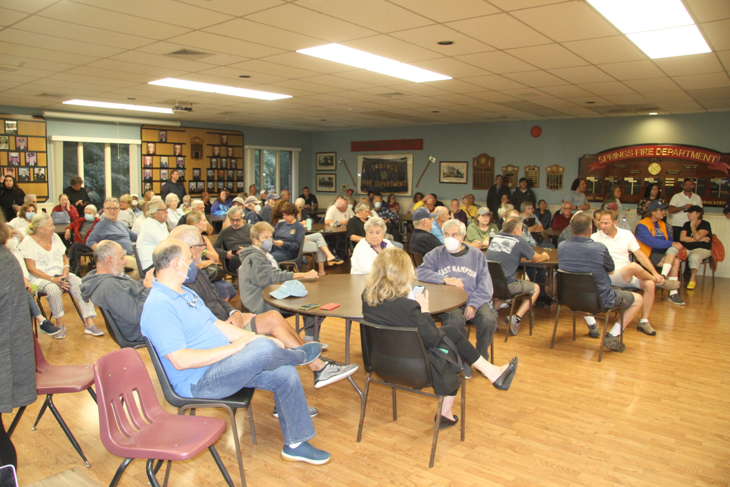 A large crowd of well over 100 residents of Springs turned out for the meeting at the firehouse, where the fire district and supporters urged them pressure town officials to sidestep the usual approval process and grant emergency authorization to the fire department to mount antennas on its tower.
