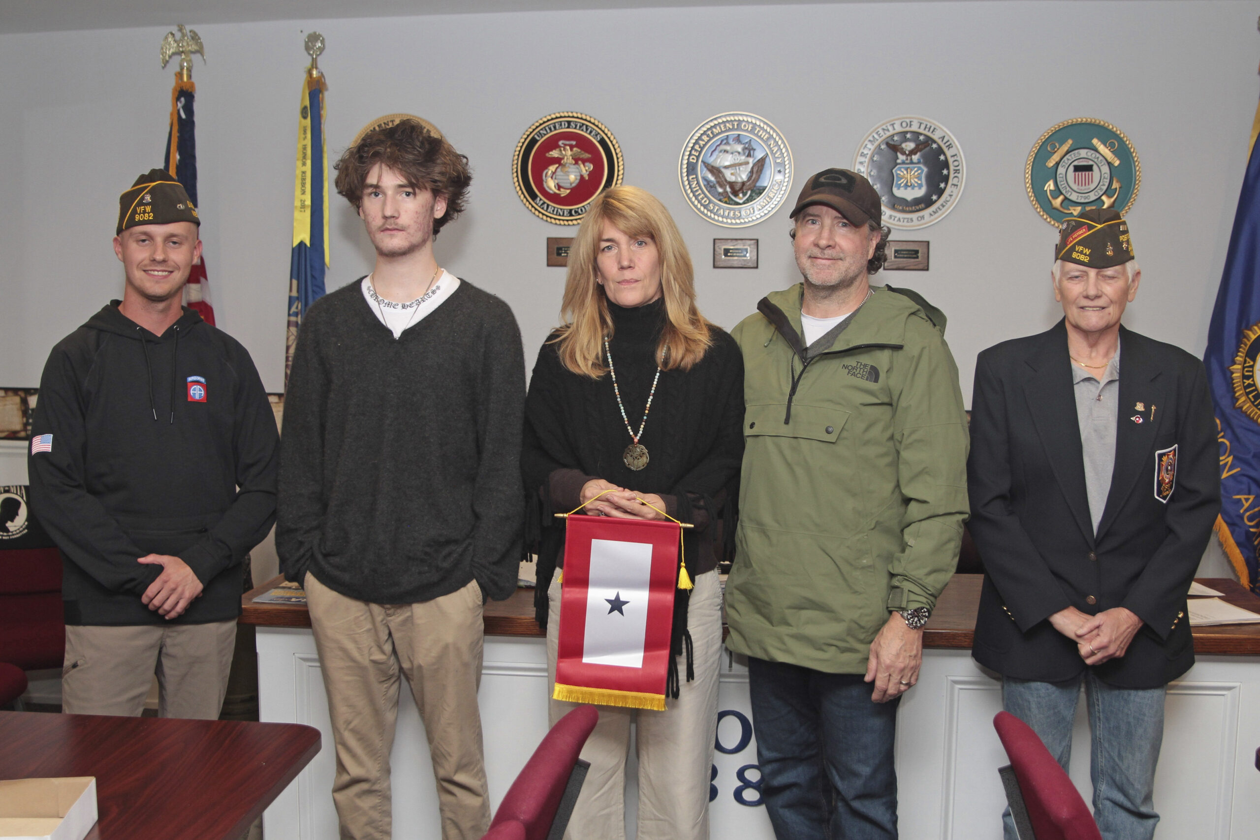 The Sag Harbor VFW recognized Blue Star families on  October 17. Left to right are:  Max Yardley, Rob and Cathy Hansen, Rob Brown and Sharon Lewis. It’s an American tradition to display a Blue Star Service Banner in the window of a home when a loved one serving in the U.S. Armed Forces. The blue star represents one family member serving, and a banner can have up to five stars.   TOM KOCHIE