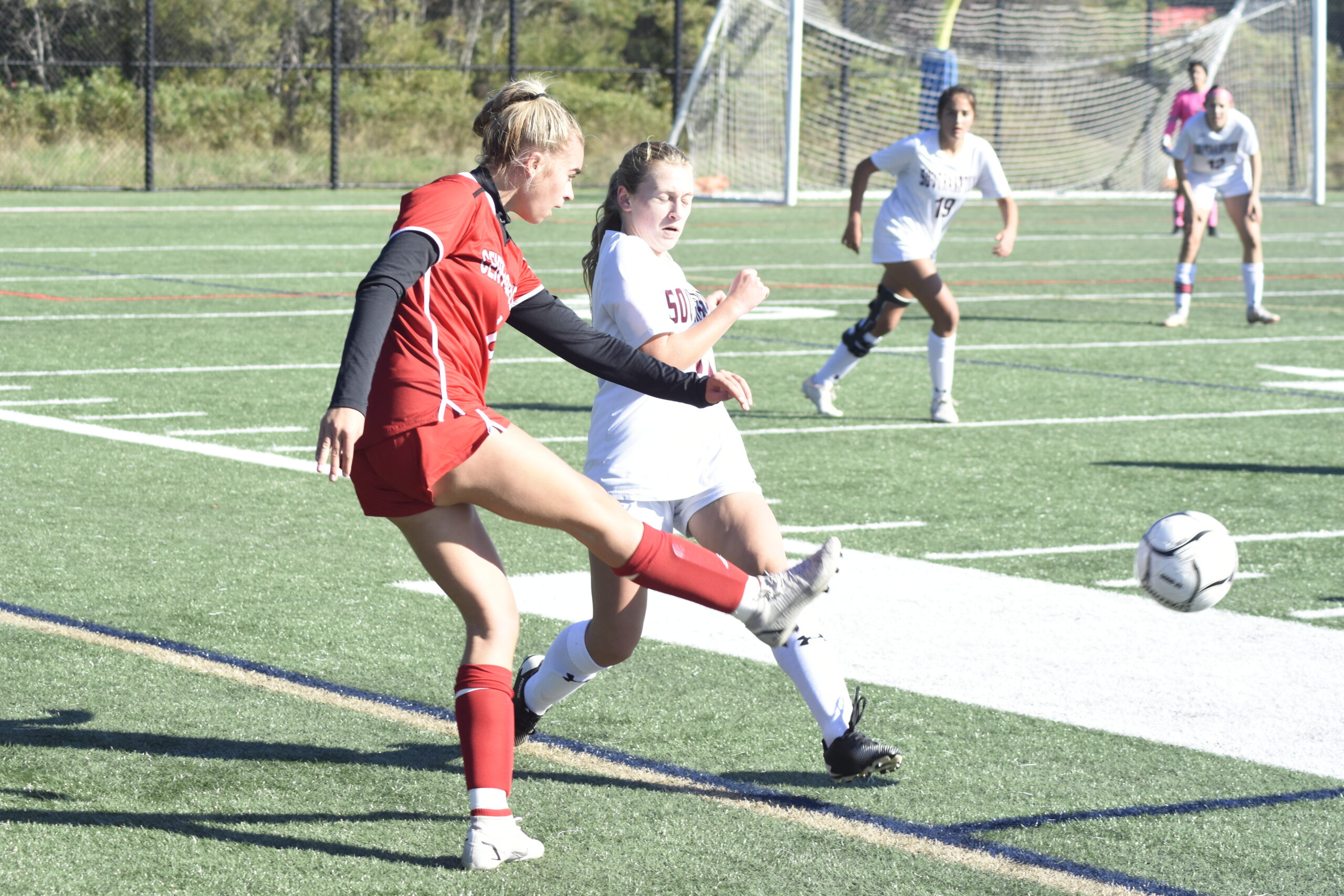 Southampton sophomore Jaylin Maloney tries to intercept a pass by a Center Moriches player.    DREW BUDD