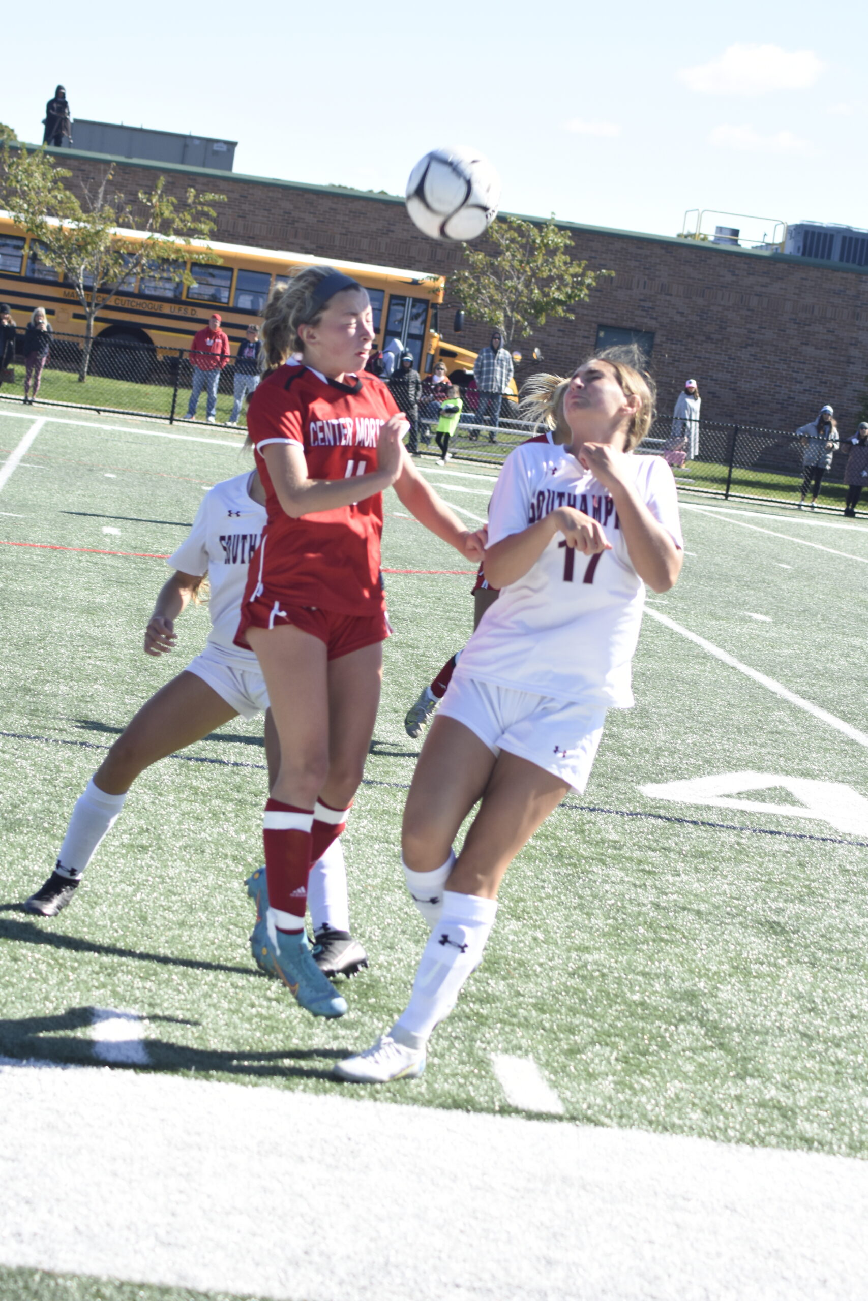 Southampton sophomore Ella Liebnitzky goes up with a Center Moriches player to head the ball.   DREW BUDD