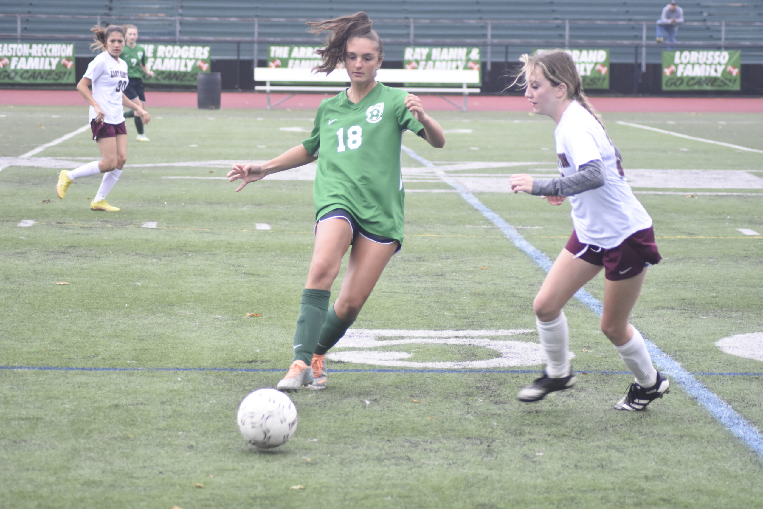Westhampton Beach junior Katie Baker passes to a teammate along the sideline.    DREW BUDD