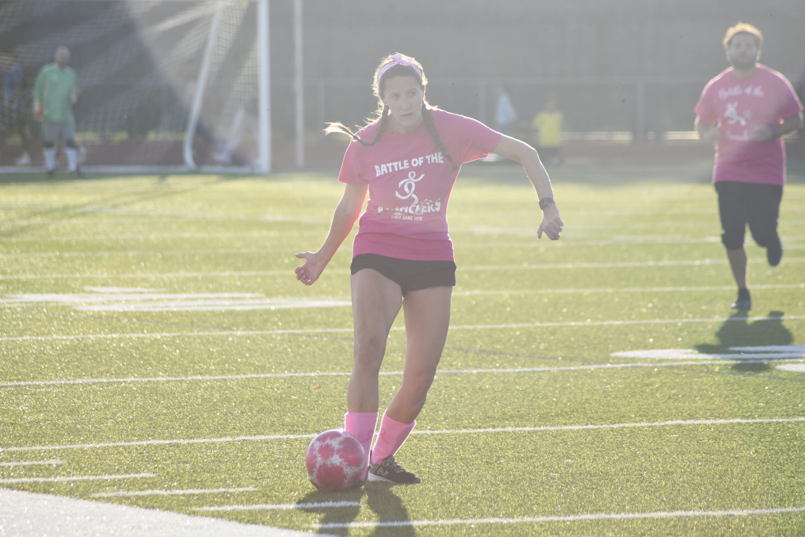 John M. Marshall Elementary School physical education teacher and varsity girls lacrosse coach Jessica Sanna dribbles the ball downfield.   DREW BUDD