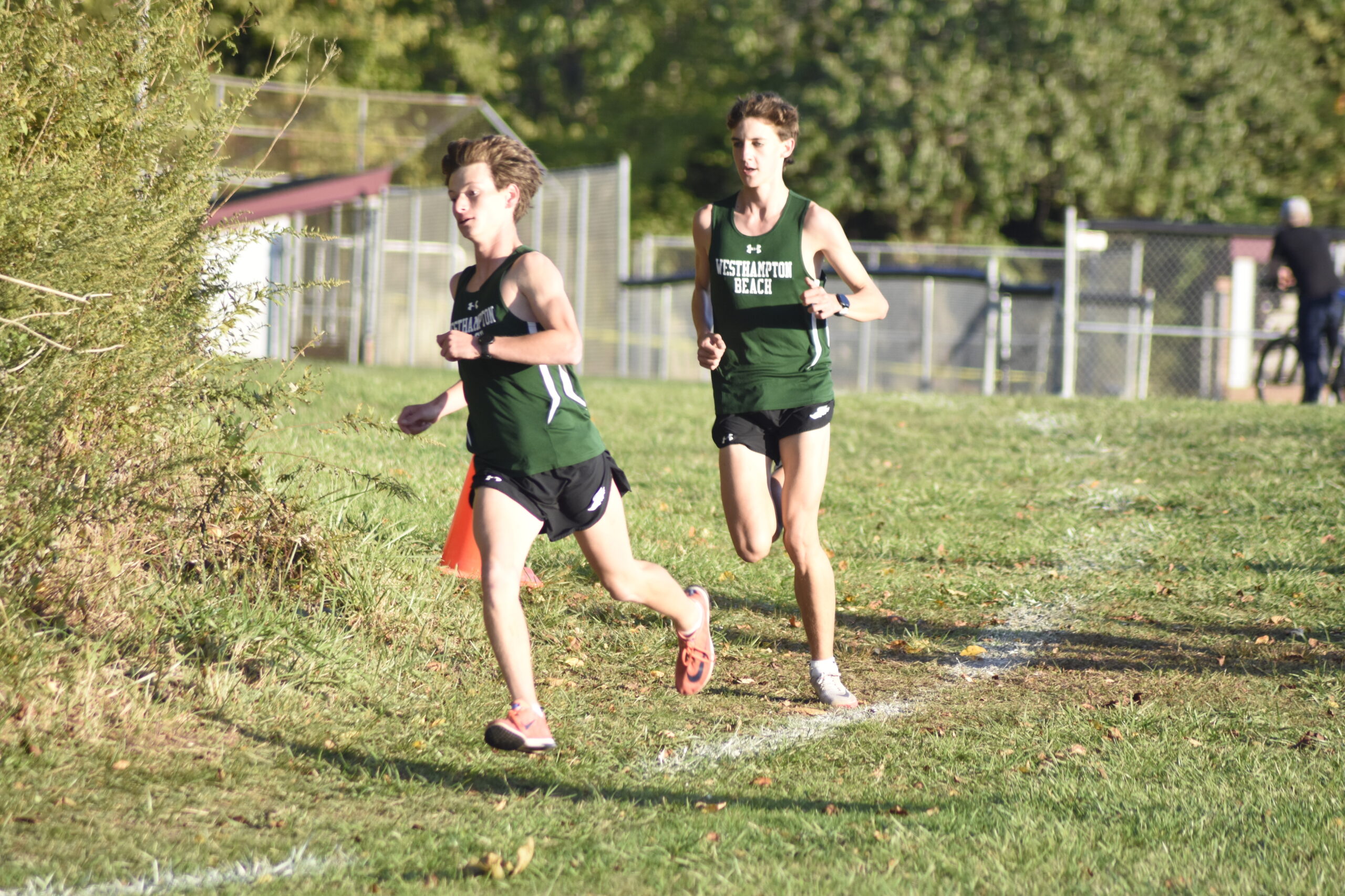 Westhampton Beach senior Max Haynia, left, and junior Trevor Hayes easily finish first and second in the boy's race.    DREW BUDD