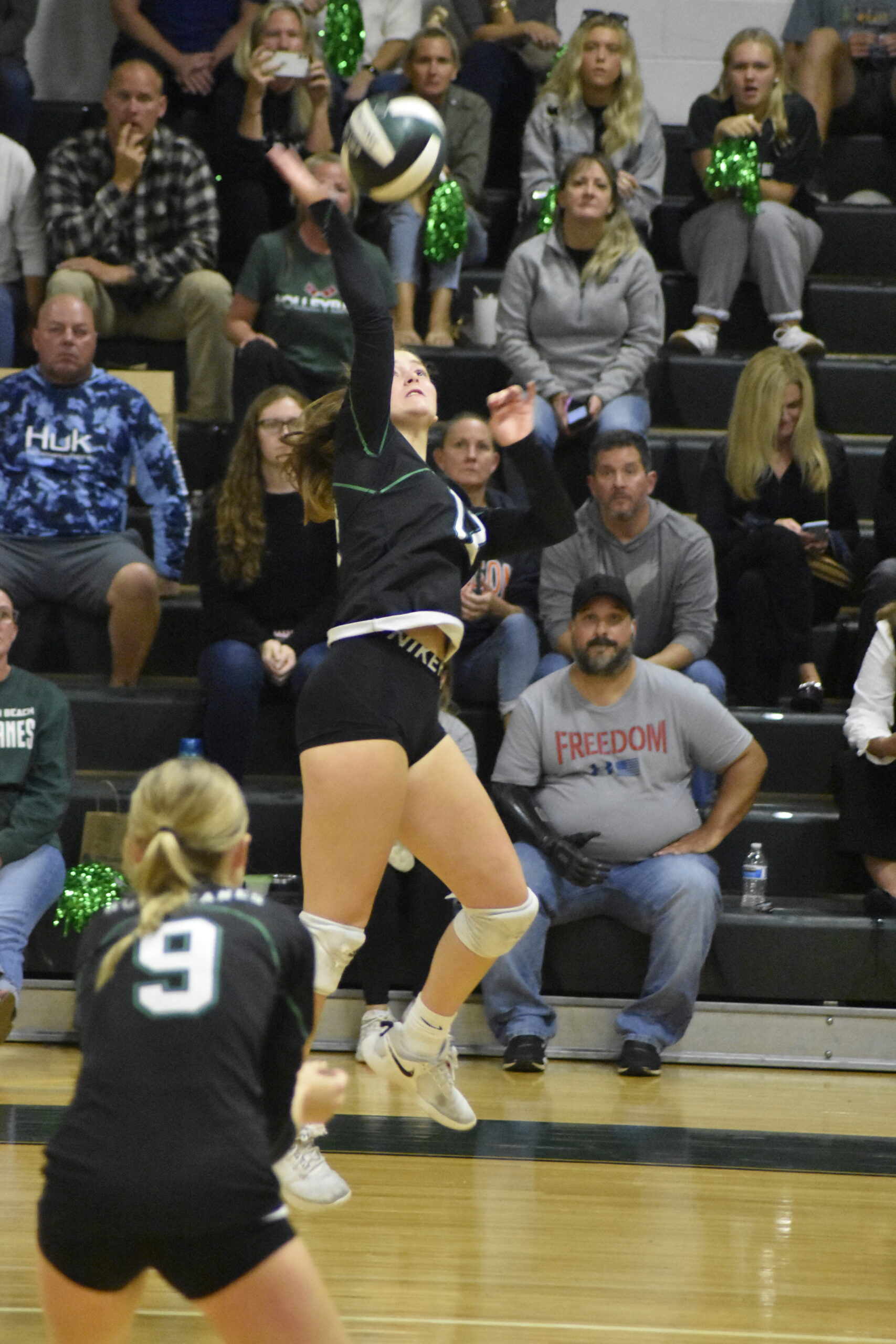 Haley Waszkelewicz hits the ball over for the Hurricanes.    DREW BUDD