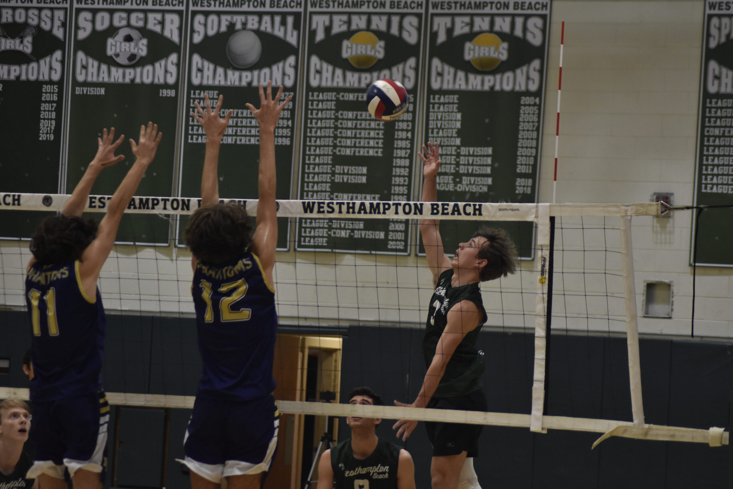 Alec Kelly of Westhampton Beach hits the ball over the net.    DREW BUDD